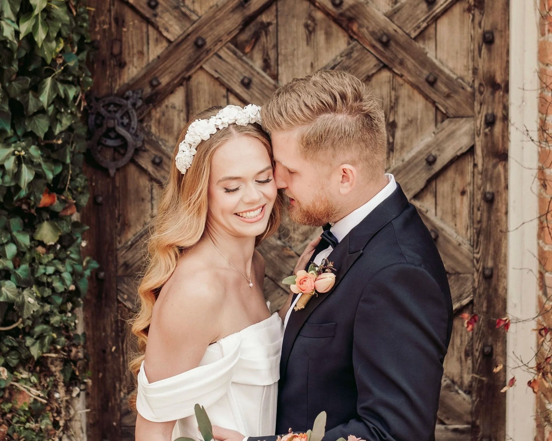 elegant white floral headband worn by bride with loose hollywood waves