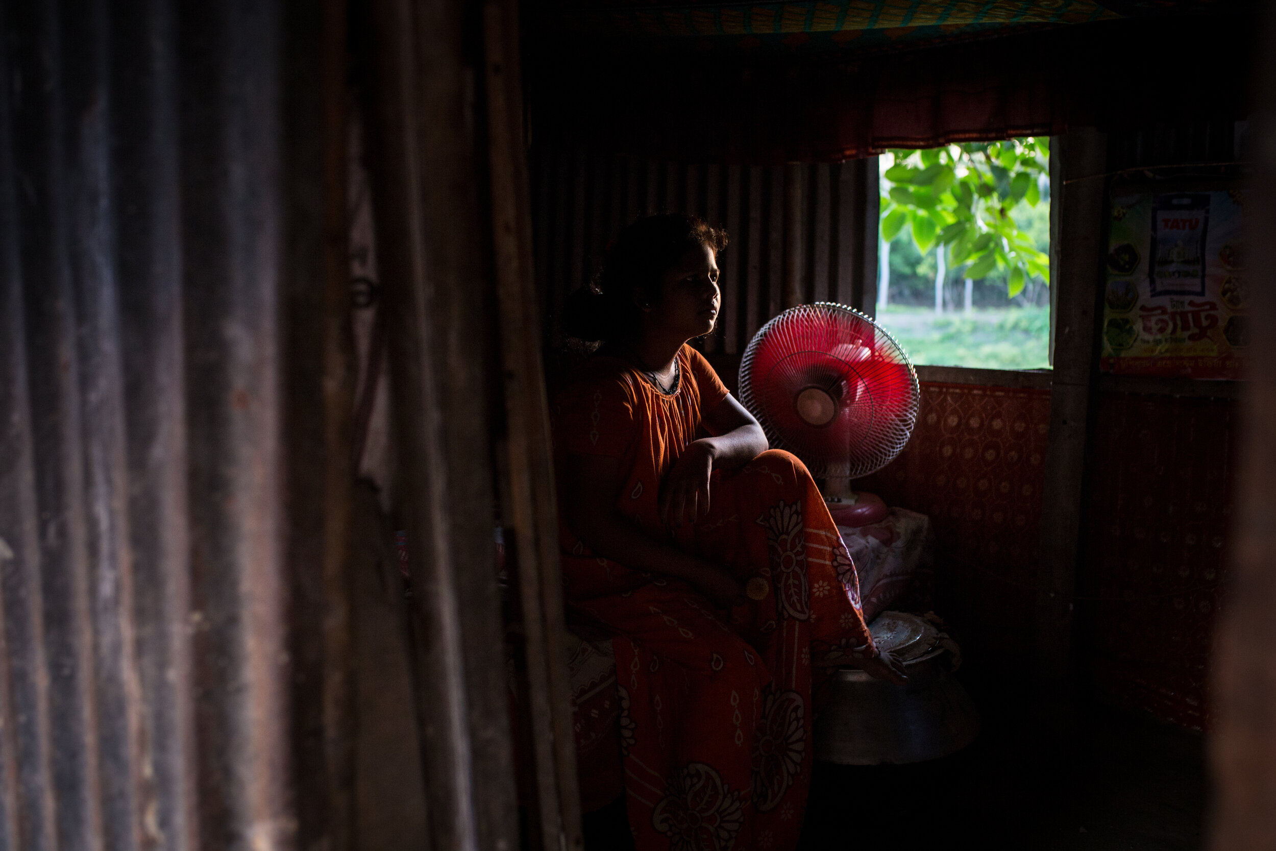  Bashita's* daughter watched TV at their hut in West Bengal, India. She was promised 5 lakh rupees (six thousand euros), but is yet to receive the money because the recipient died.    *name changed 