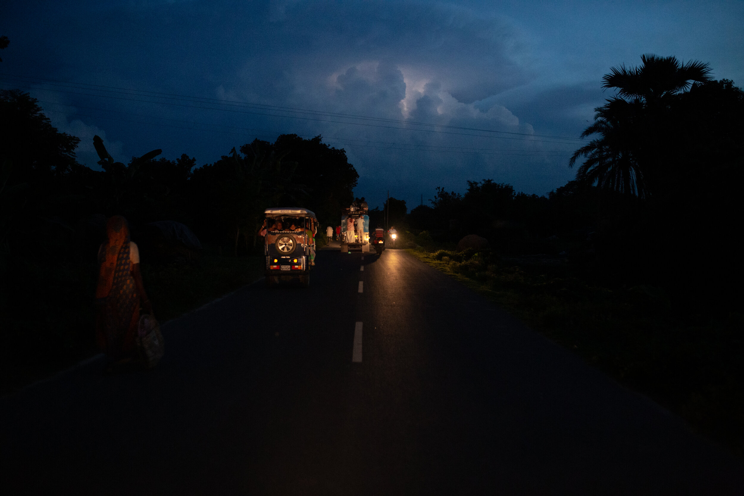  People make their way home during a monsoon storm in Uttar Dinajpur, West Bengal 