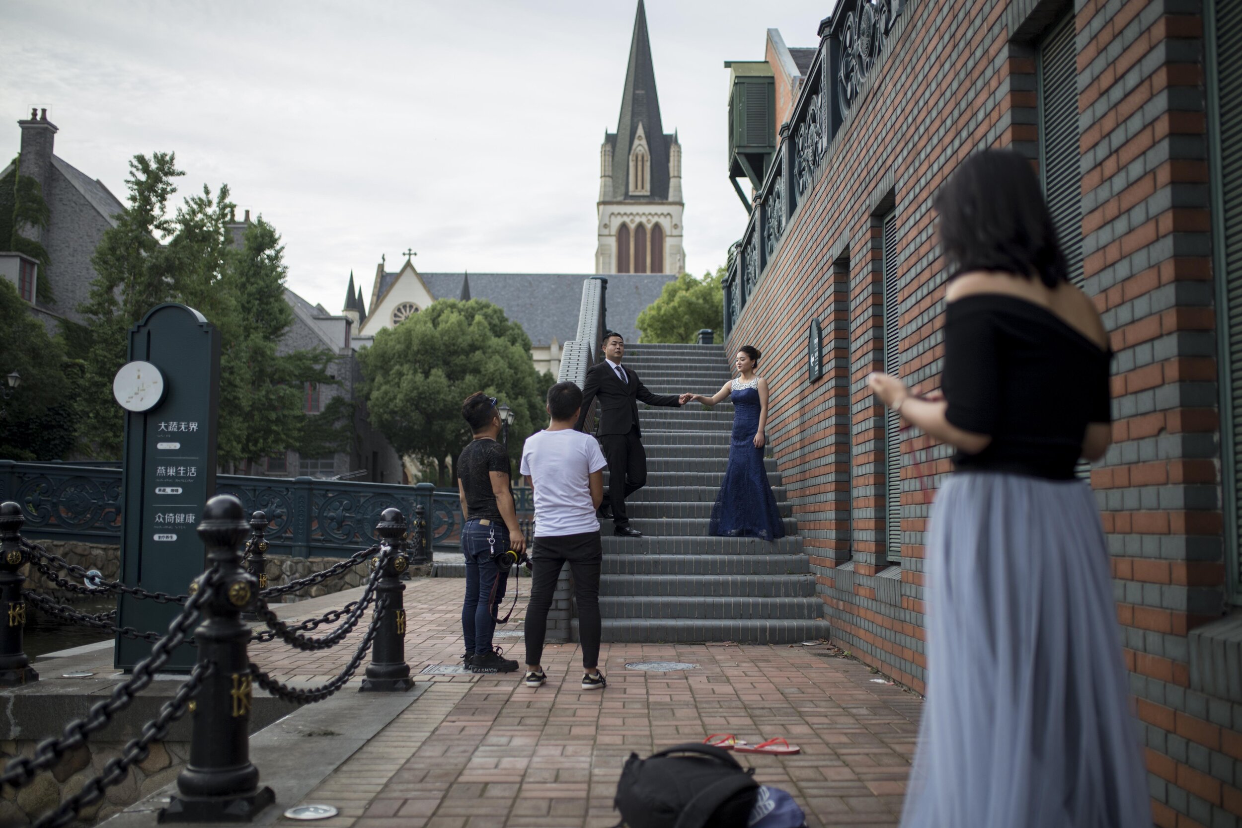  A newly wed couple poses for a photo in Thames Town, a replica of an English city near Shanghai. The wedding photography business has taken off in recent years.  