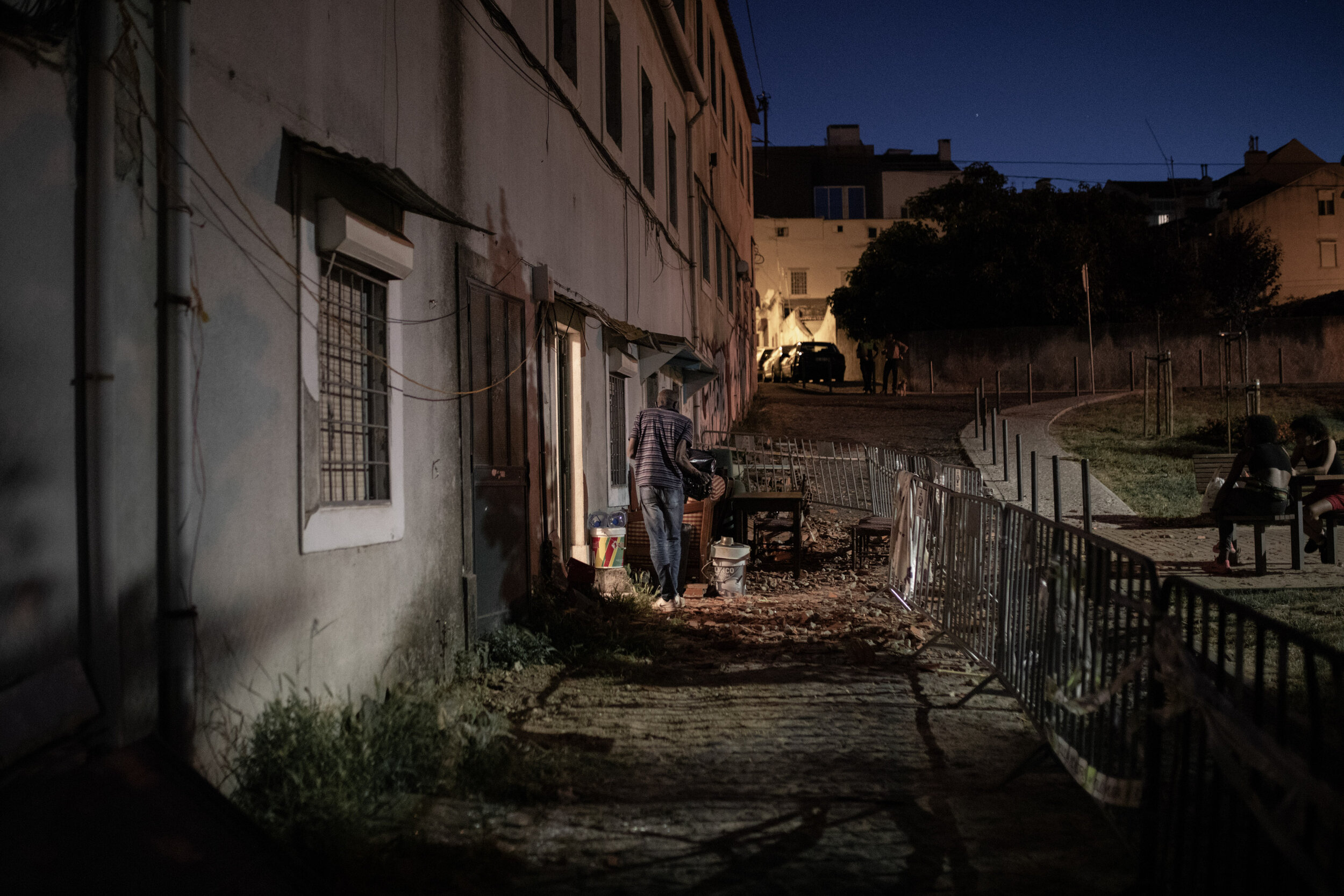  A man takes things out of his home in Quinta de Santo António. He was a part of a group of 30 people that were occupying these abandoned homes and were evicted by Lisbon’s City Hall.  