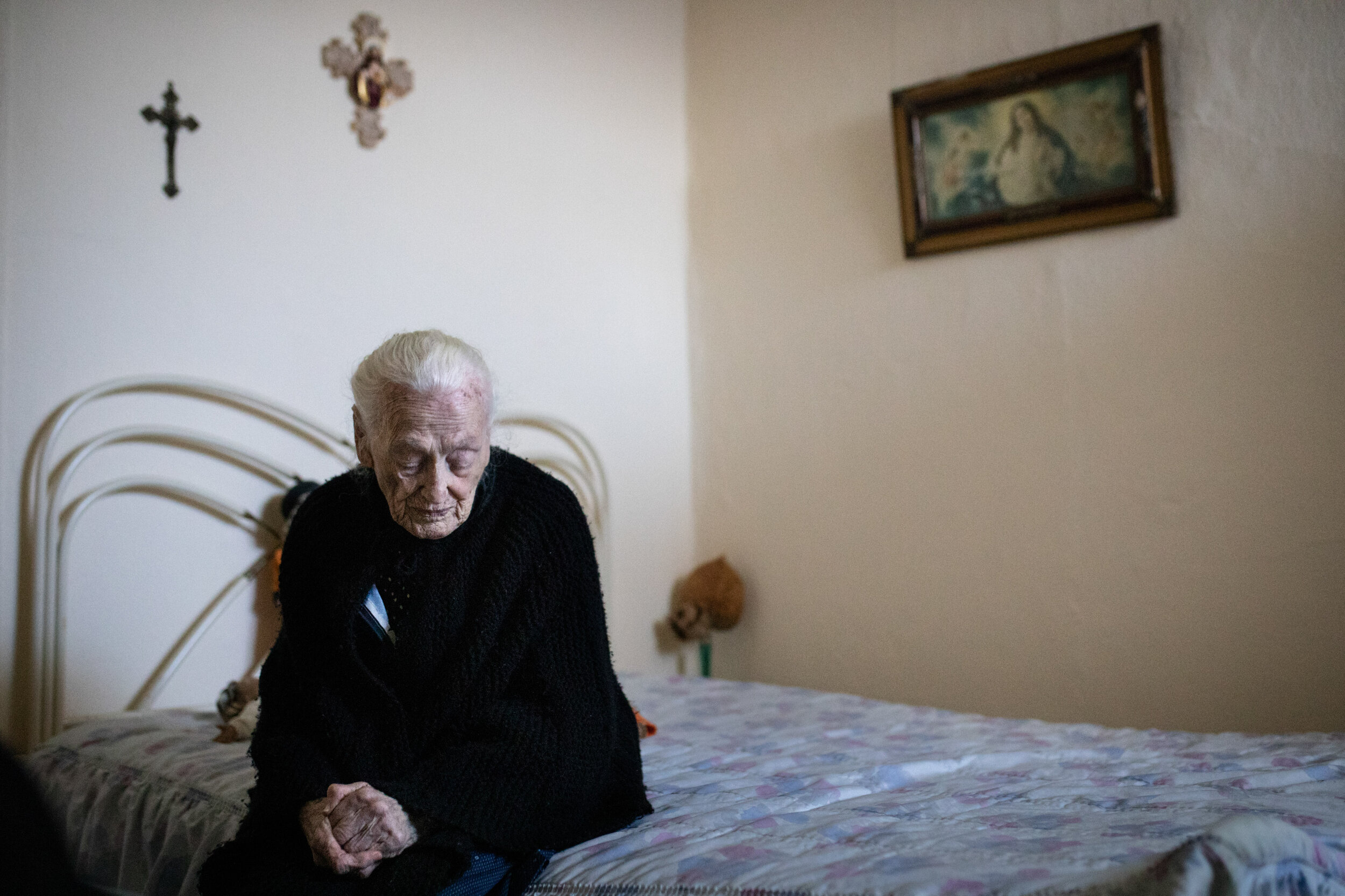  Emilia Raposo, 94 poses for a portrait in her bedroom in the Santos Lima building. “I was born here and I raised three boys in this small apartment, this is all I know. If I am evicted, how will I survive on my own in another place?” asks Emília, a 