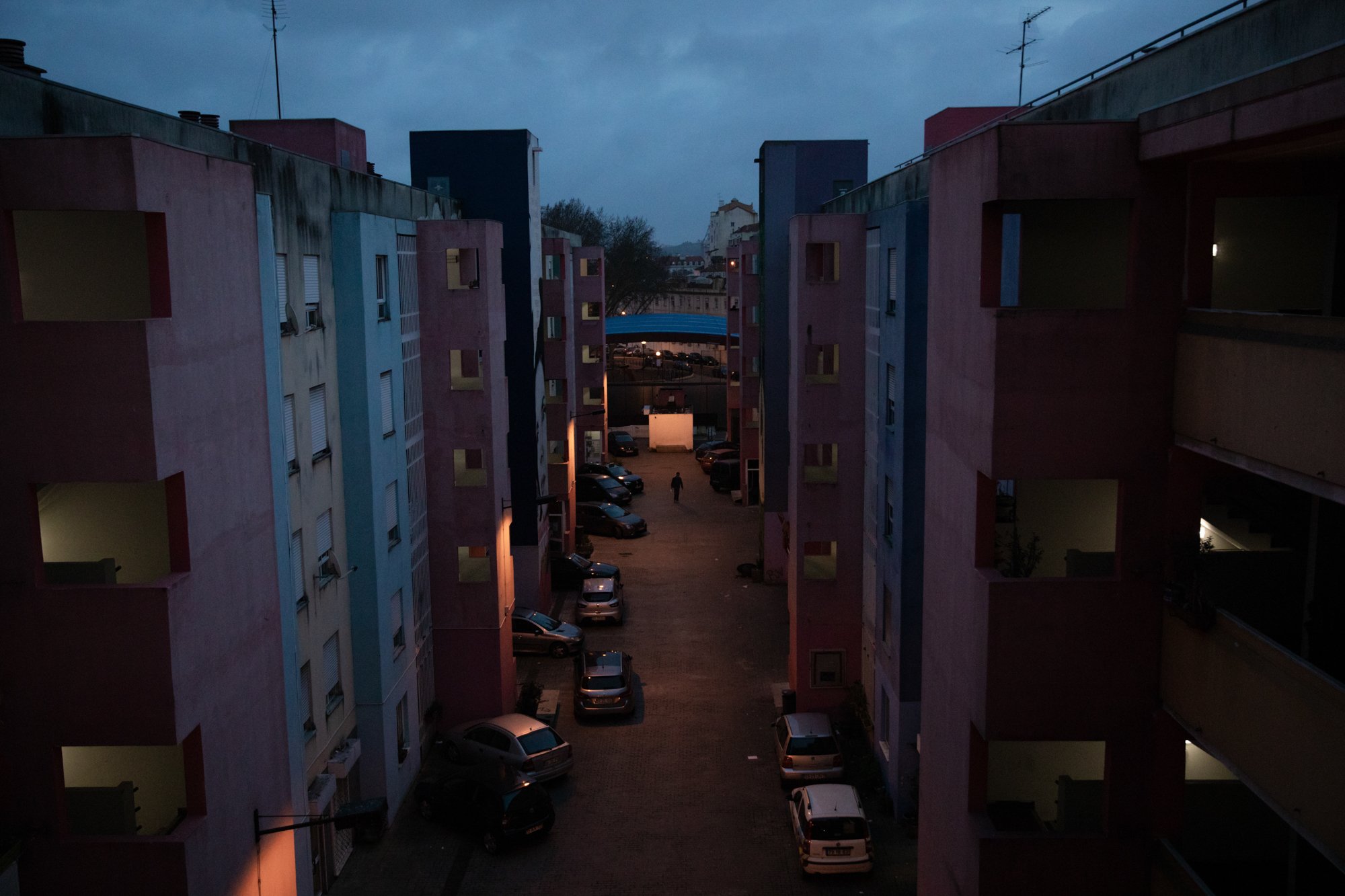  A man walks through Quinta da Cabrinha, one of the two public housing neighborhoods built after Casal Ventoso, Europe’s largest drug supermarket, was demolished in the 90’s. Lisbon. 16/02/2021 