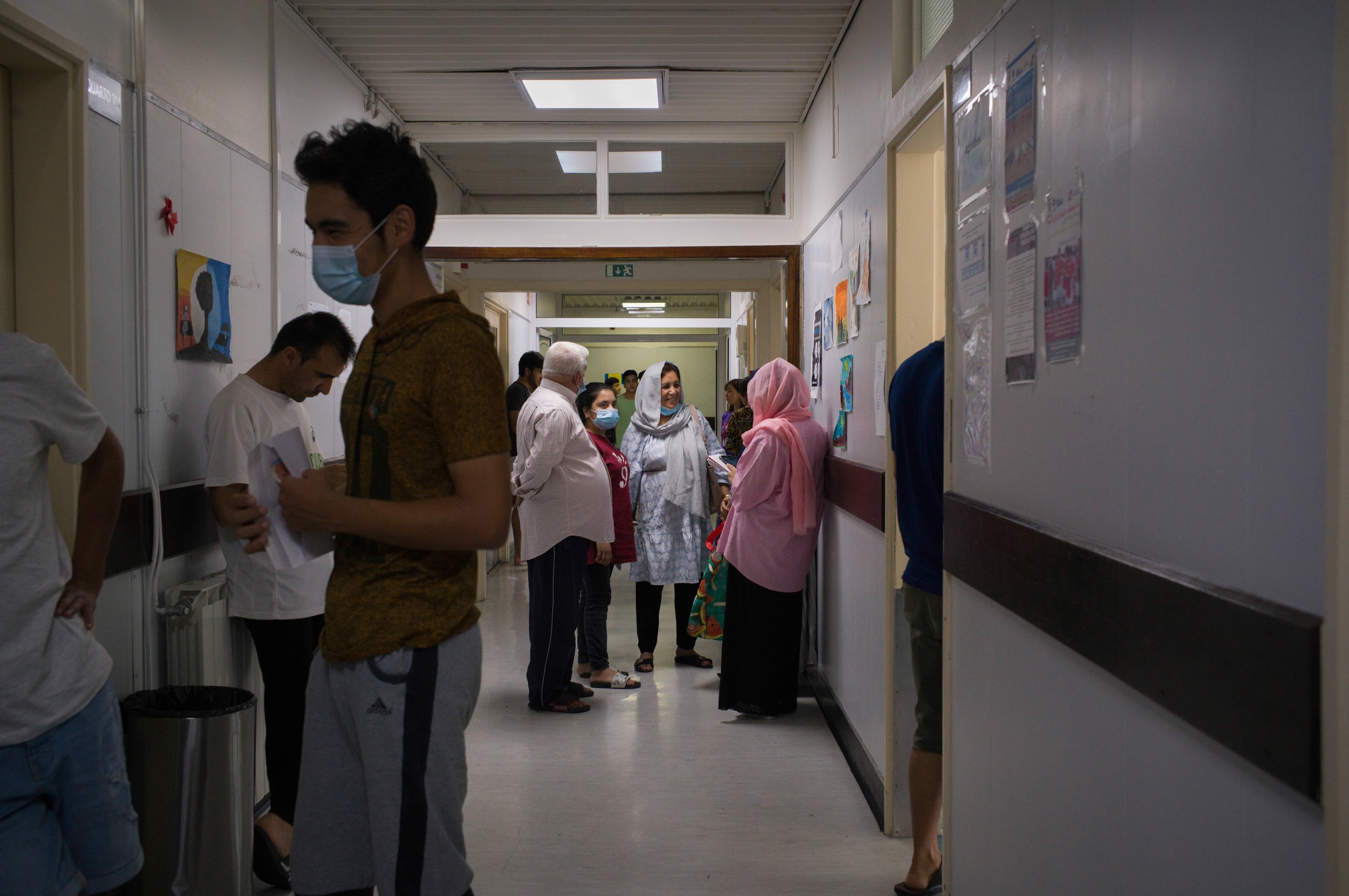  Afghan refugees line up to receive the 150 euros the Portuguese government gives them every month. Most of the money is spent of food and what little remains is sent back home. July 2022 