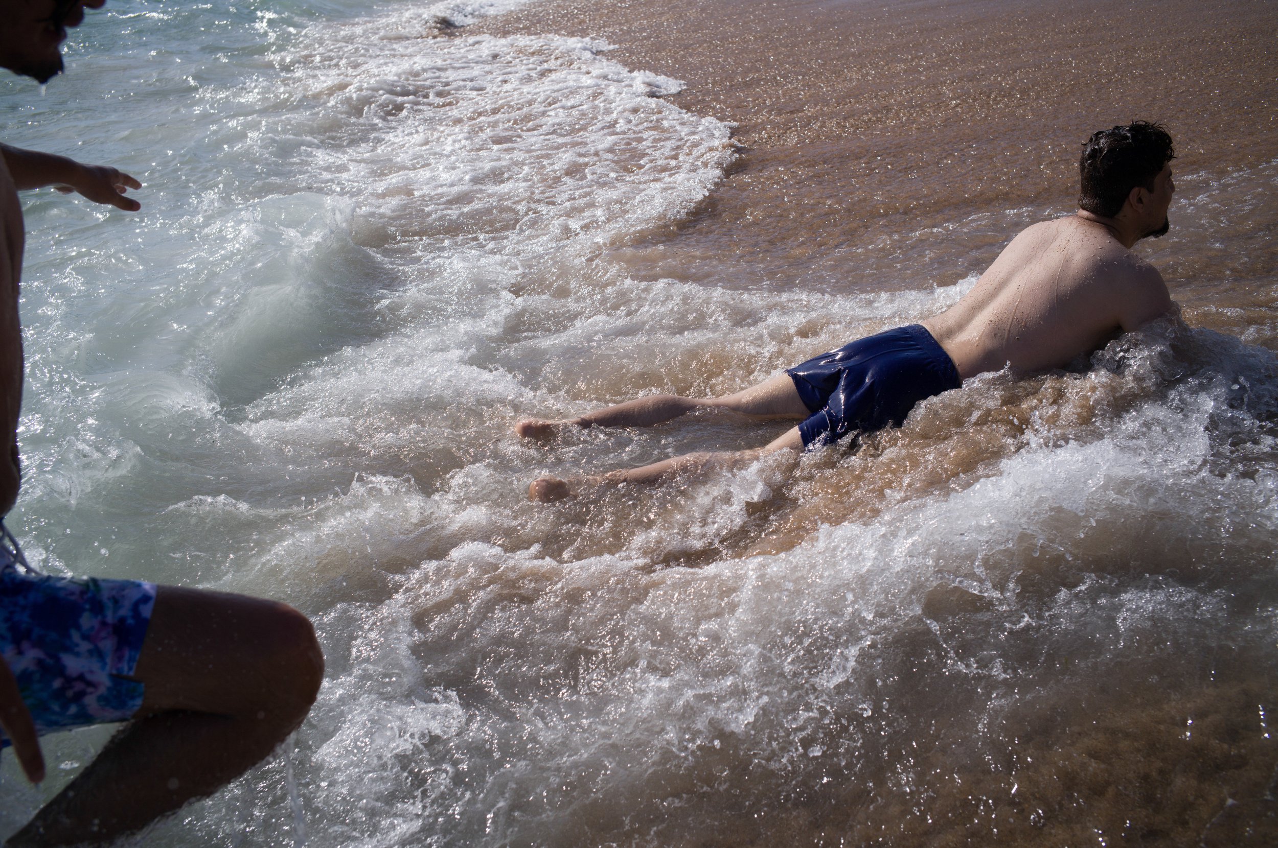  A former teacher and a student from ANIM enjoy a beach day. For many students and staff, they had never seen the ocean before coming to Portugal. July 2022 