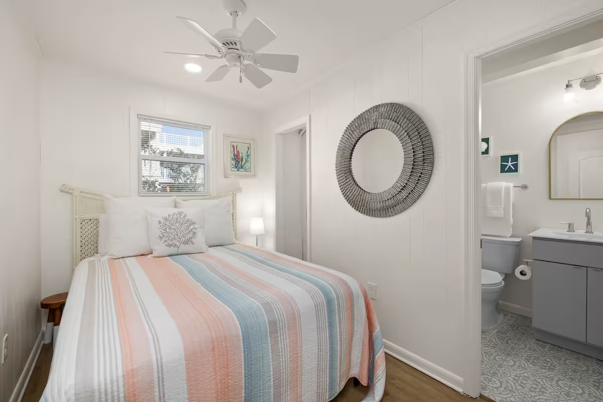 queen striped down bedroom with bath.png