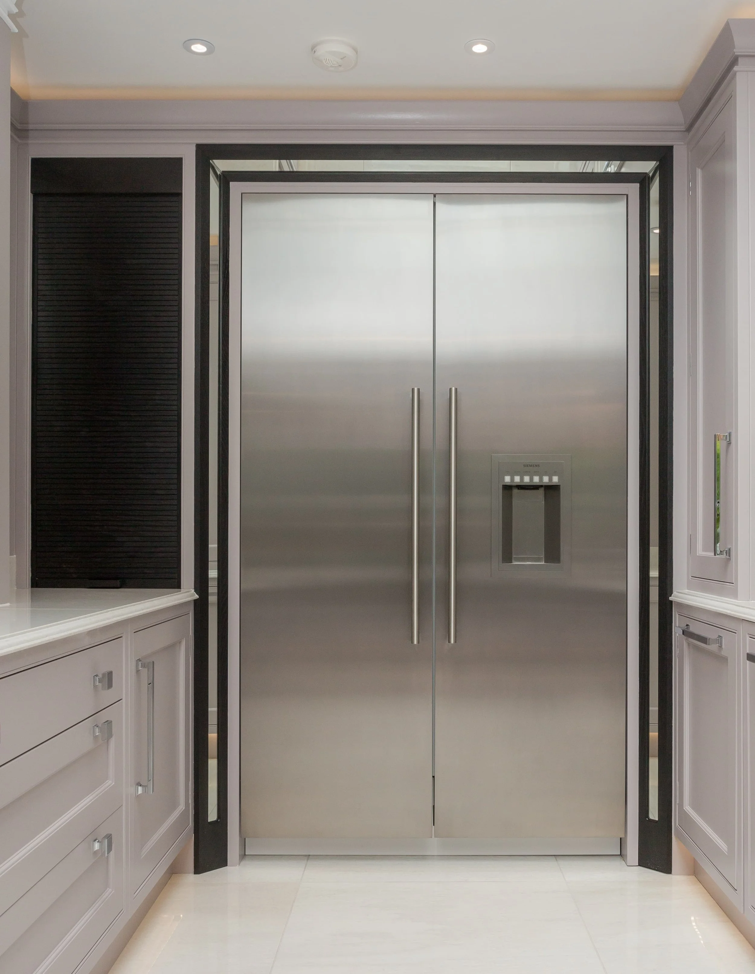 Stainless steel double fridge in a designer kitchen - Darren Morgan specialises in unique kitchens and baths with remote kitchen design services