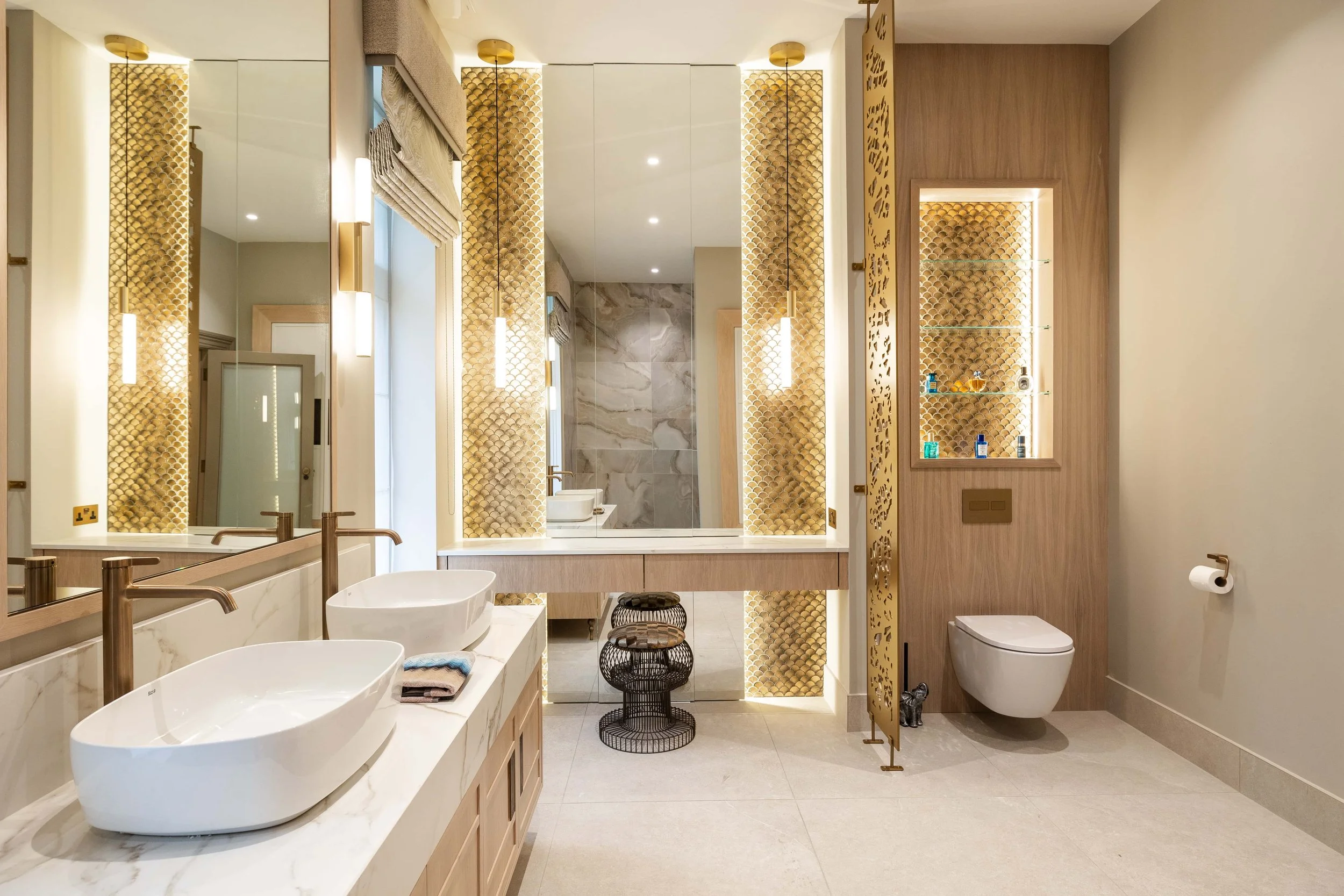 Award-winning luxury bathroom with gold detailing and bespoke vanity design