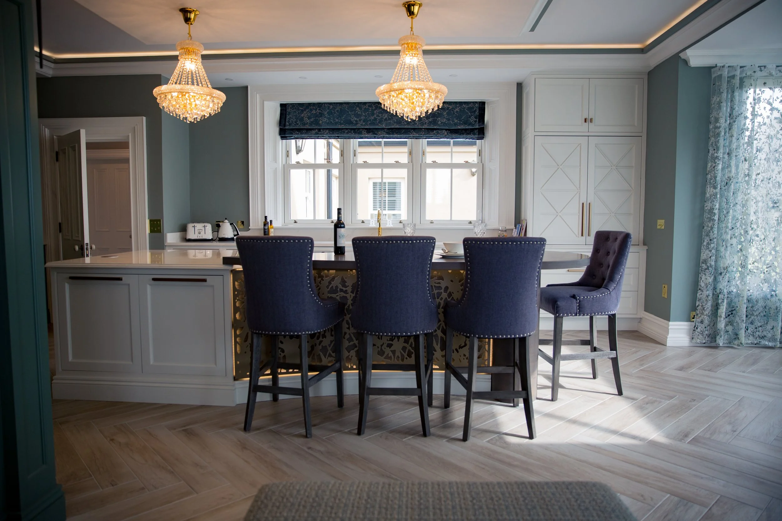 Luxury new build kitchen with island and bespoke furniture designed by Darren Morgan Design.
