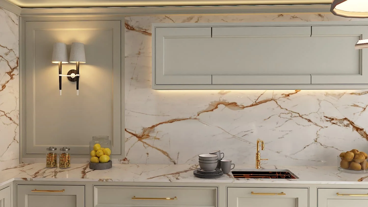 A warm, cream kitchen with marble surface and backsplash and warm lighting. Cutlery and fruit are on the work surface - Darren Morgan Design for unique kitchens and interiors