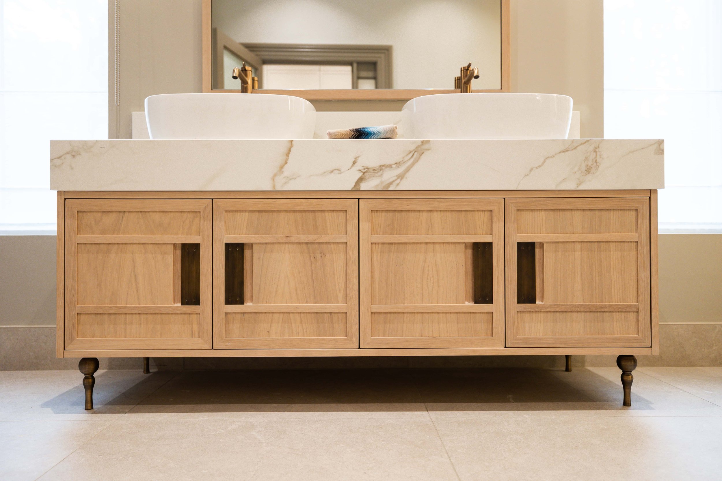 Bespoke luxury bathroom vanity unit with mitred frame detailing