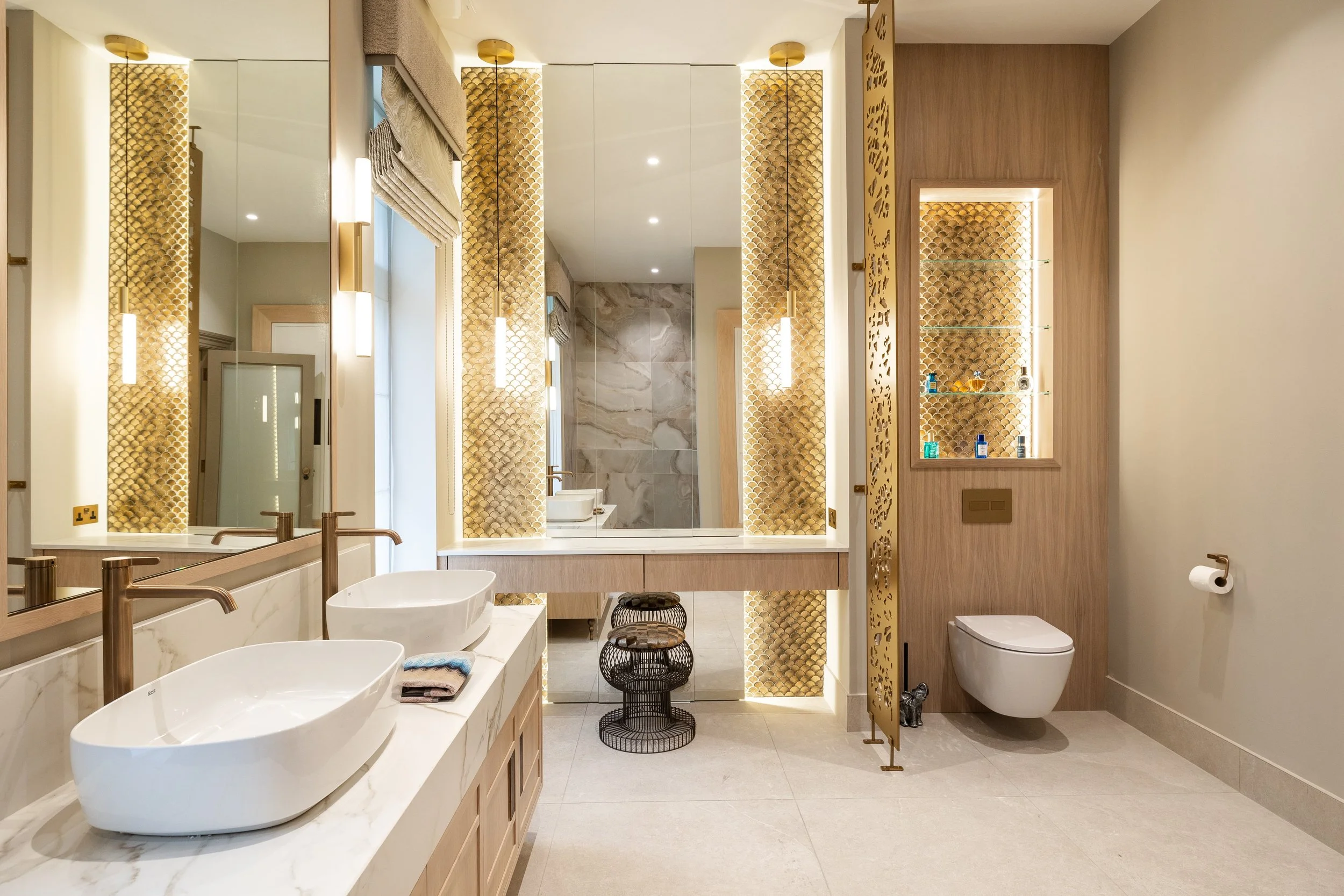 Award-winning completed bathroom with twin basins, bespoke vanity and illuminated decorative panels.
