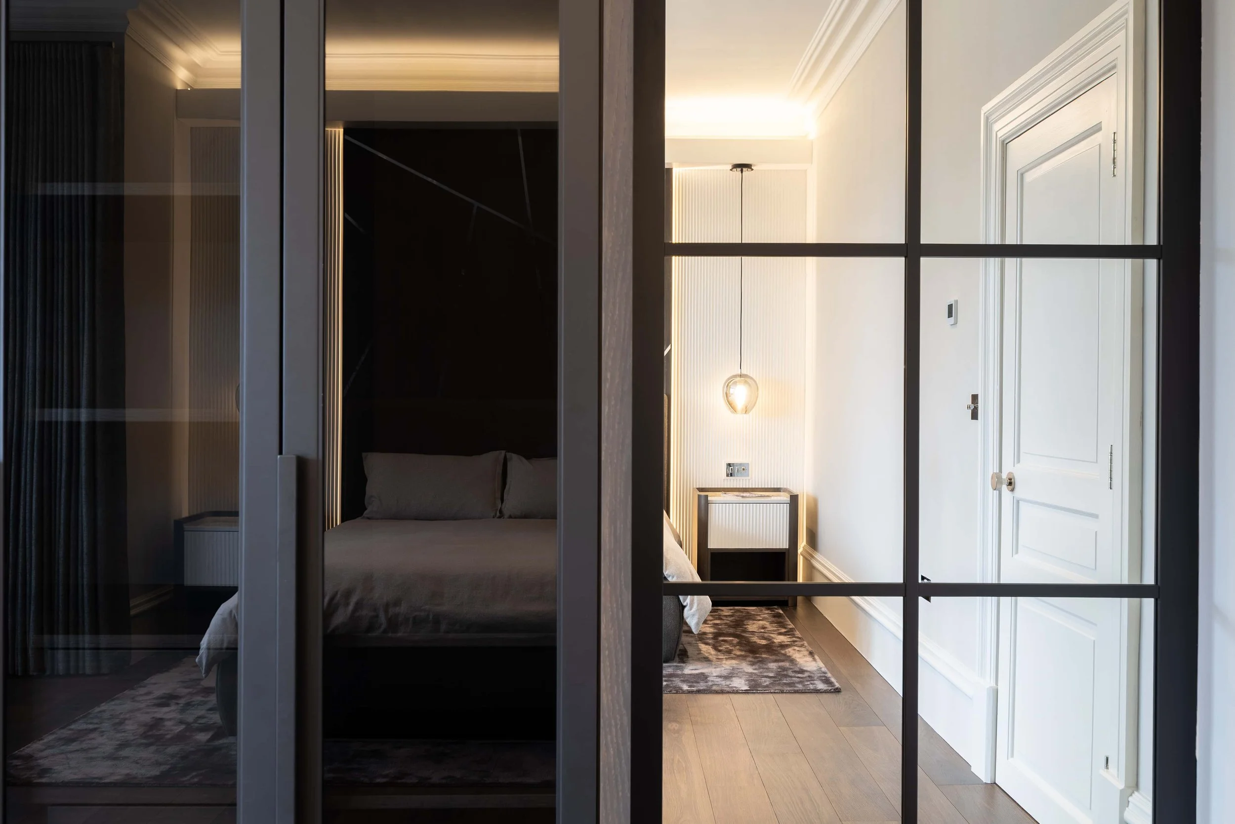 Contemporary luxury bedroom with bespoke cabinetry and feature lighting