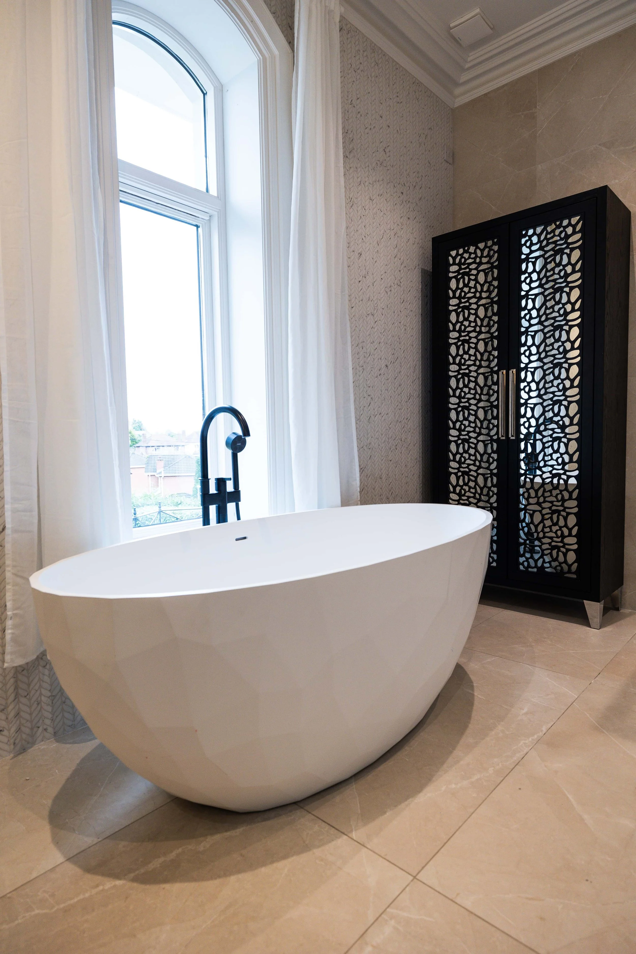 Luxury contemporary bathroom with bespoke furniture and architectural detailing