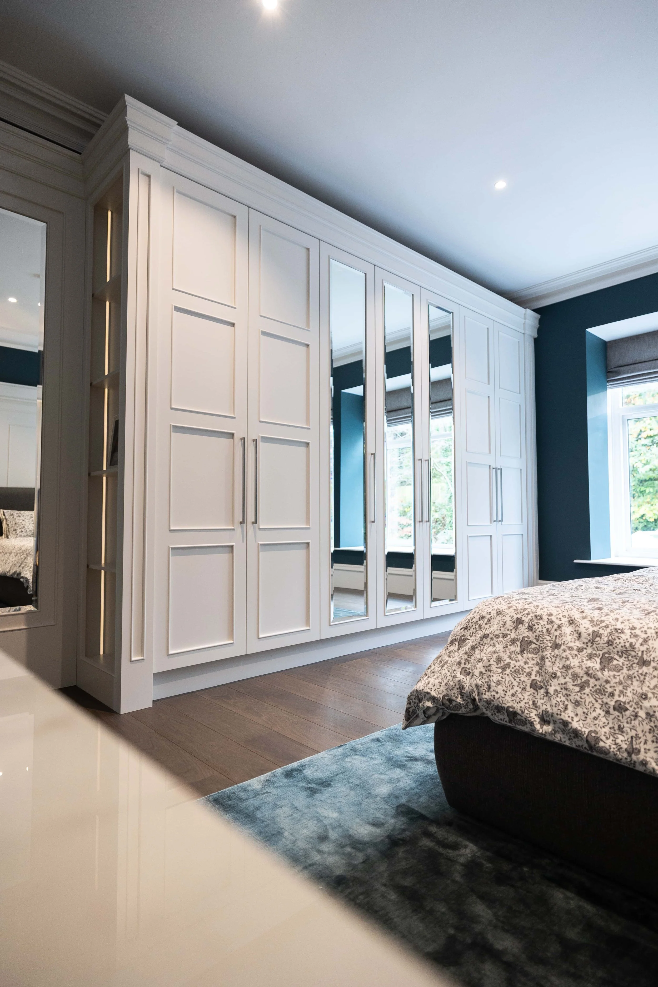 Luxury bespoke wardrobe and dressing room with custom cabinetry