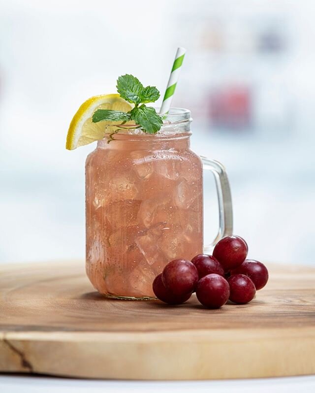 Sweet Celebration grape lemonade with a sprig of mint, the perfect afternoon treat!