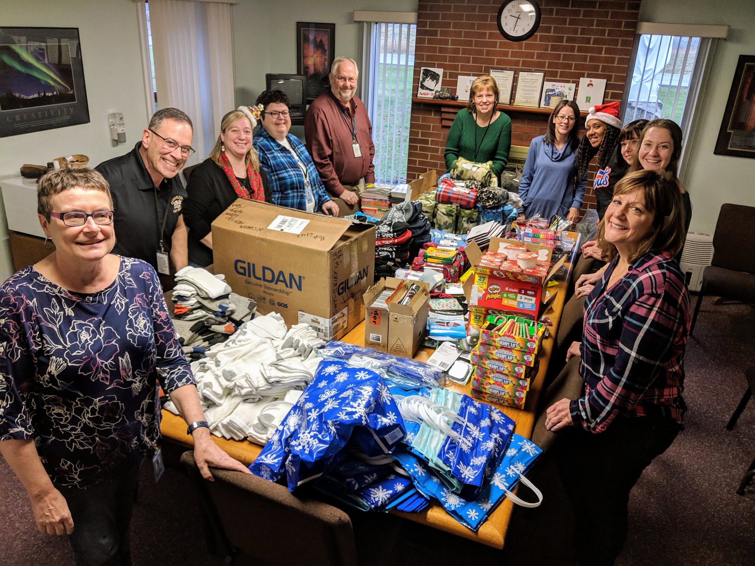 The Staff Elf Brigade making holiday gift bags for the kids
