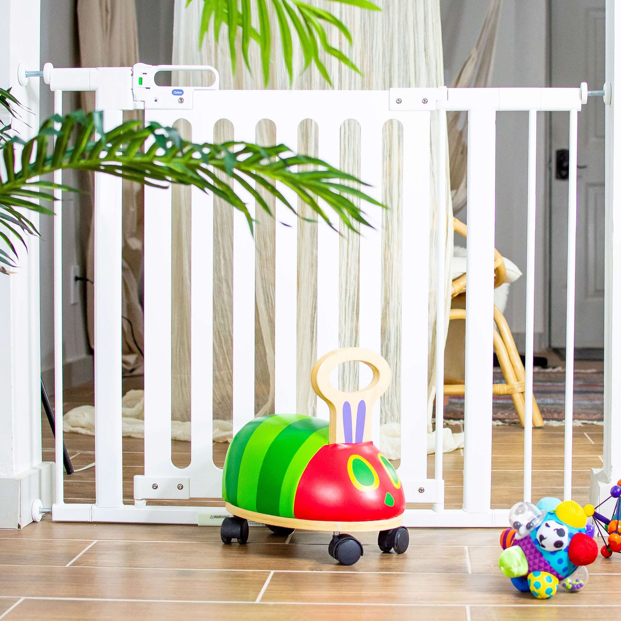 Spectrum Designer Baby Gate with toys in front