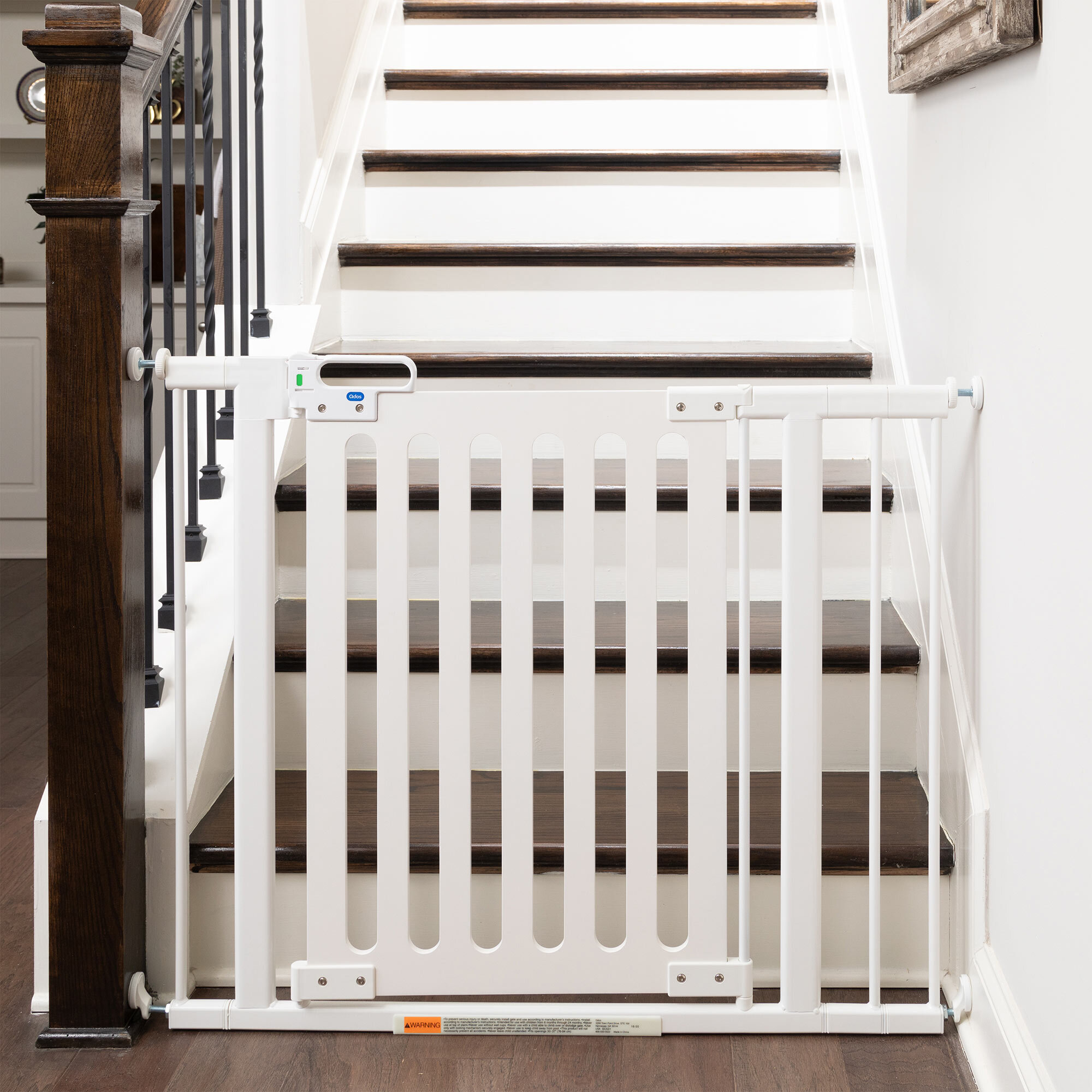 Spectrum Designer Baby Gate at bottom of stairs