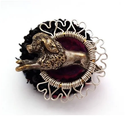 brooch with vintage french poodle leaping through a hoop made of sterling silver wire hearts with black crystals