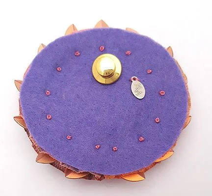 back of vintage heart pin made into rosette brooch with ribbon cockade