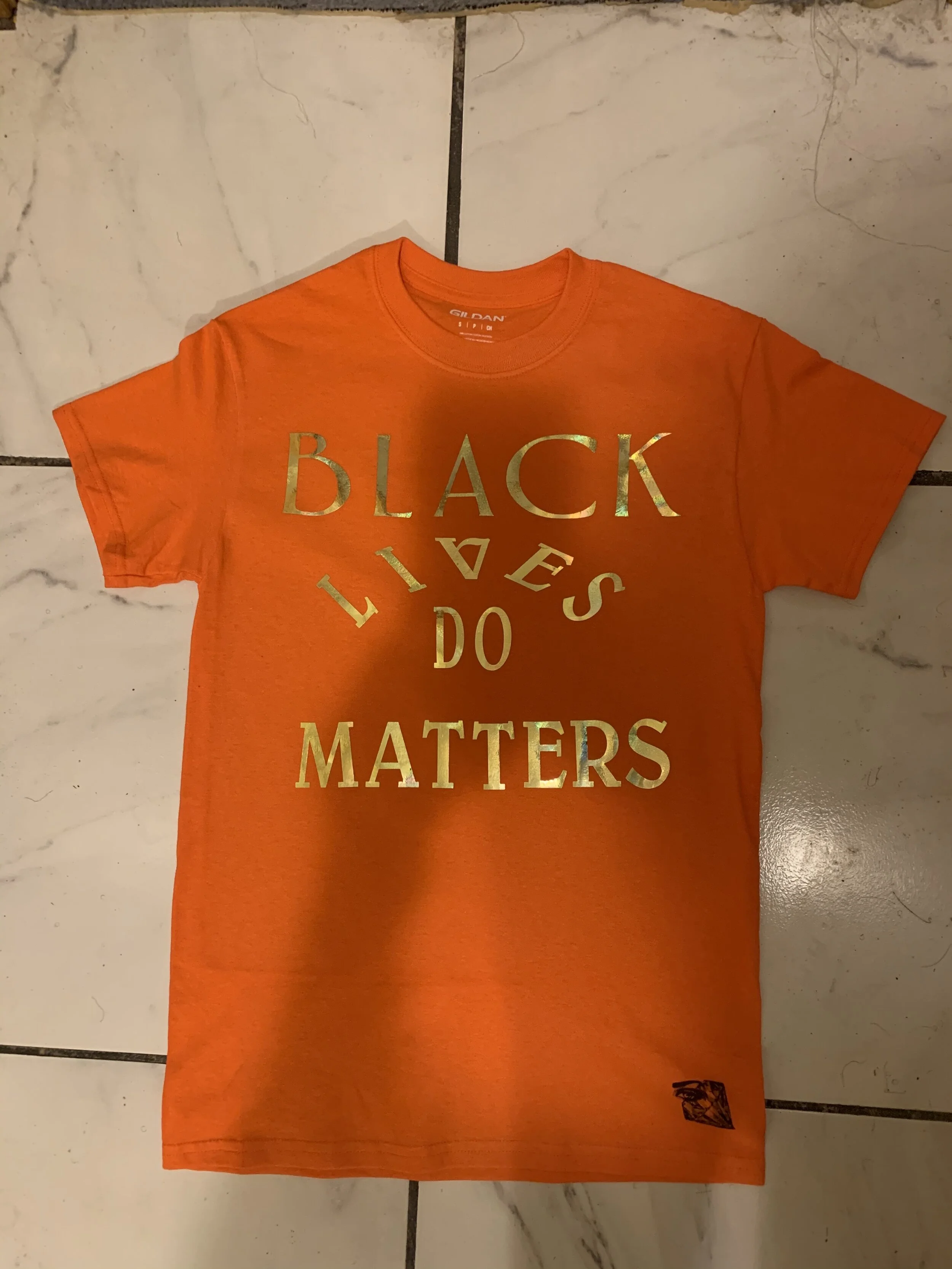 Orange shirt with black writing Clearance