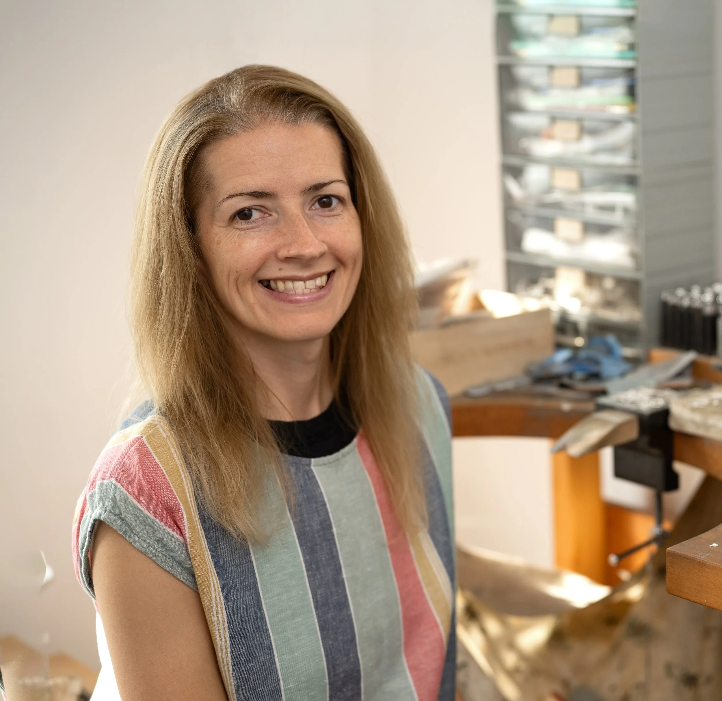 Elizabeth Designs jewellery sitting at jewellery bench.