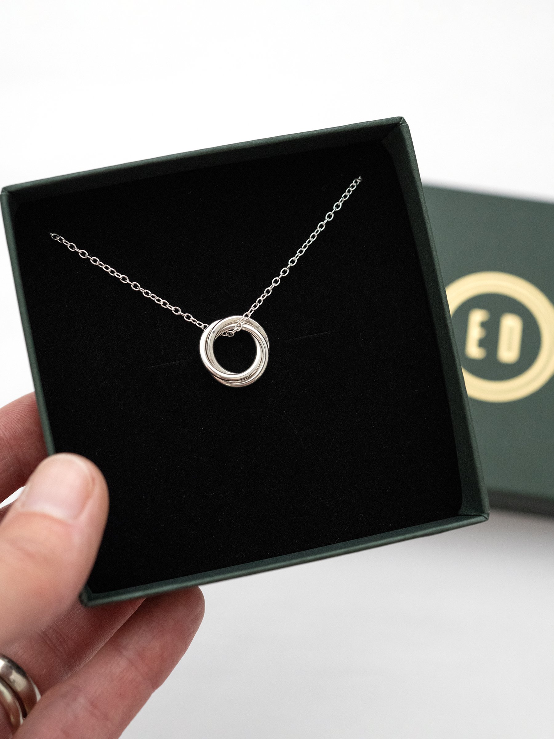 A sterling silver 30th birthday necklace displayed in a Elizabeth Designs jewellery presentation box.