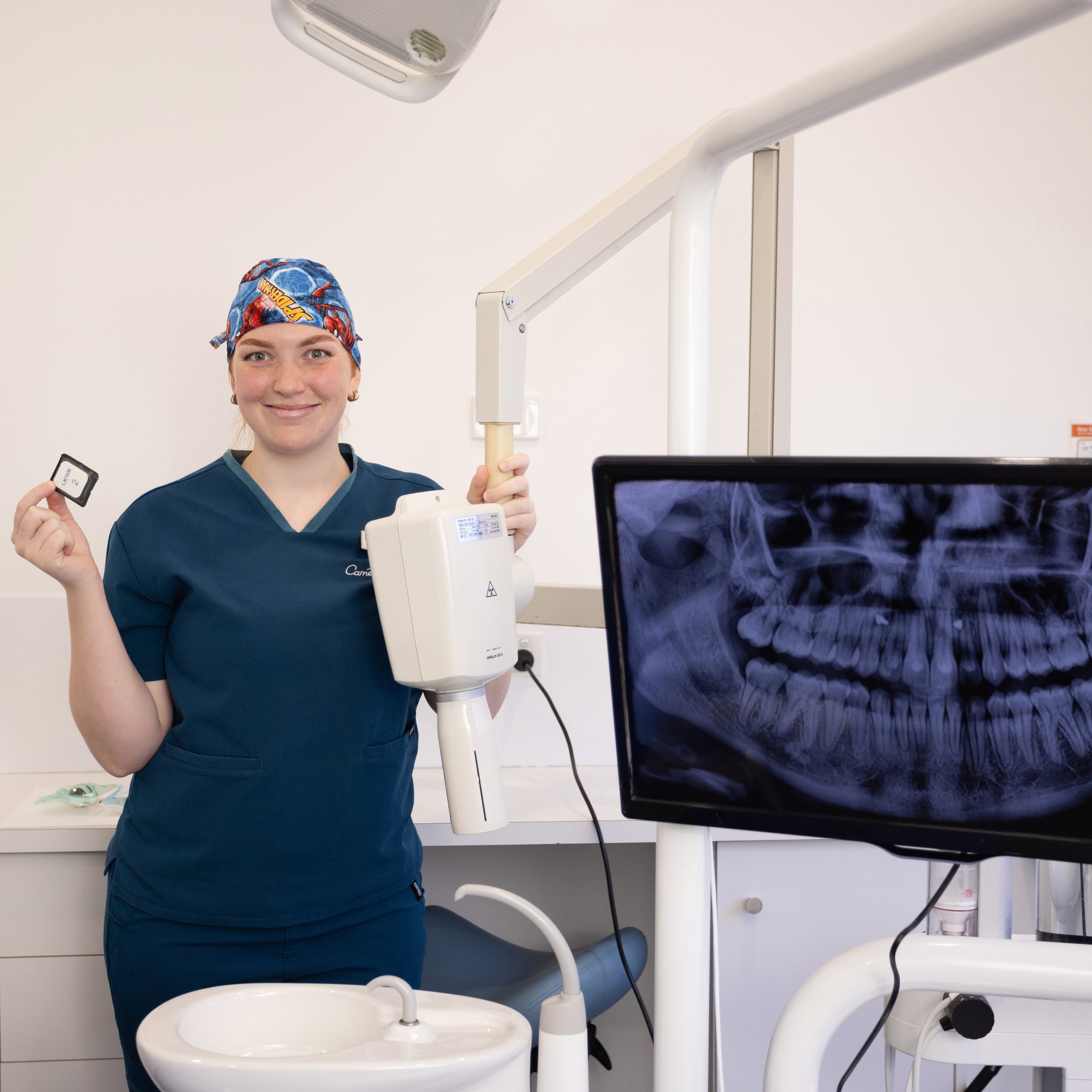 Hannah with a digital x-ray at Cameron and Co Dental