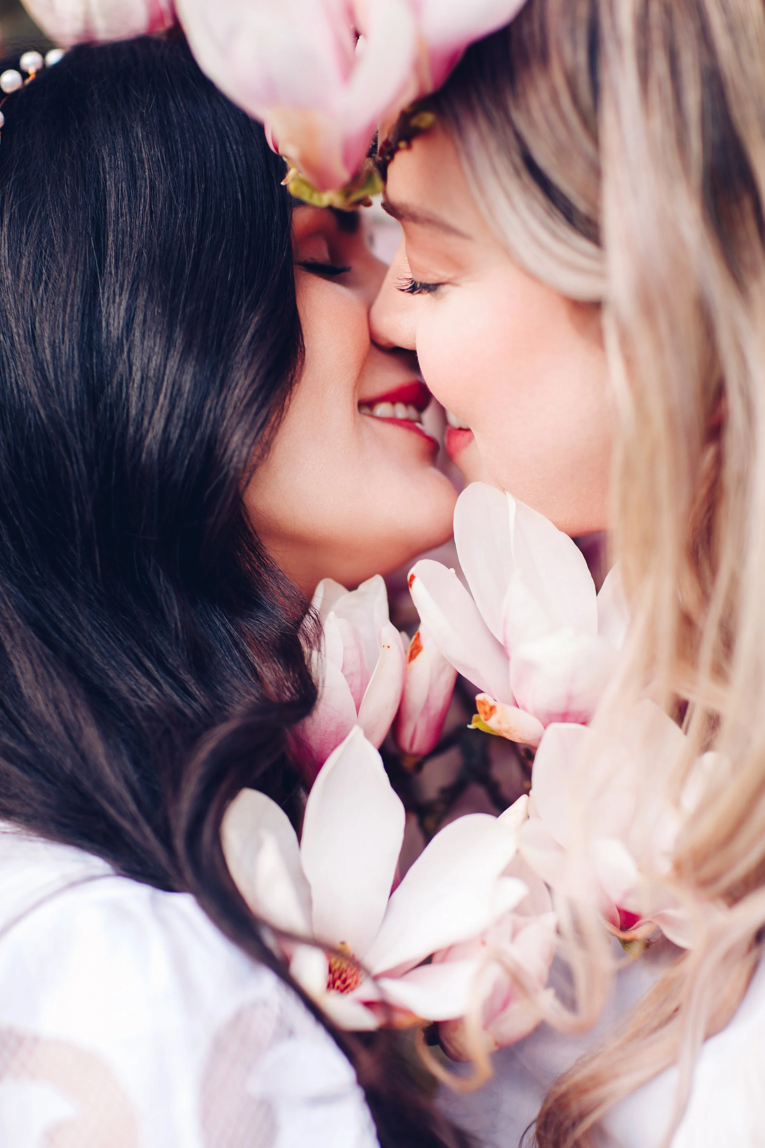 Lesbian Couple Engagement Photoshoot at Volunteer Park, Seattle during Cherry Blossom Season