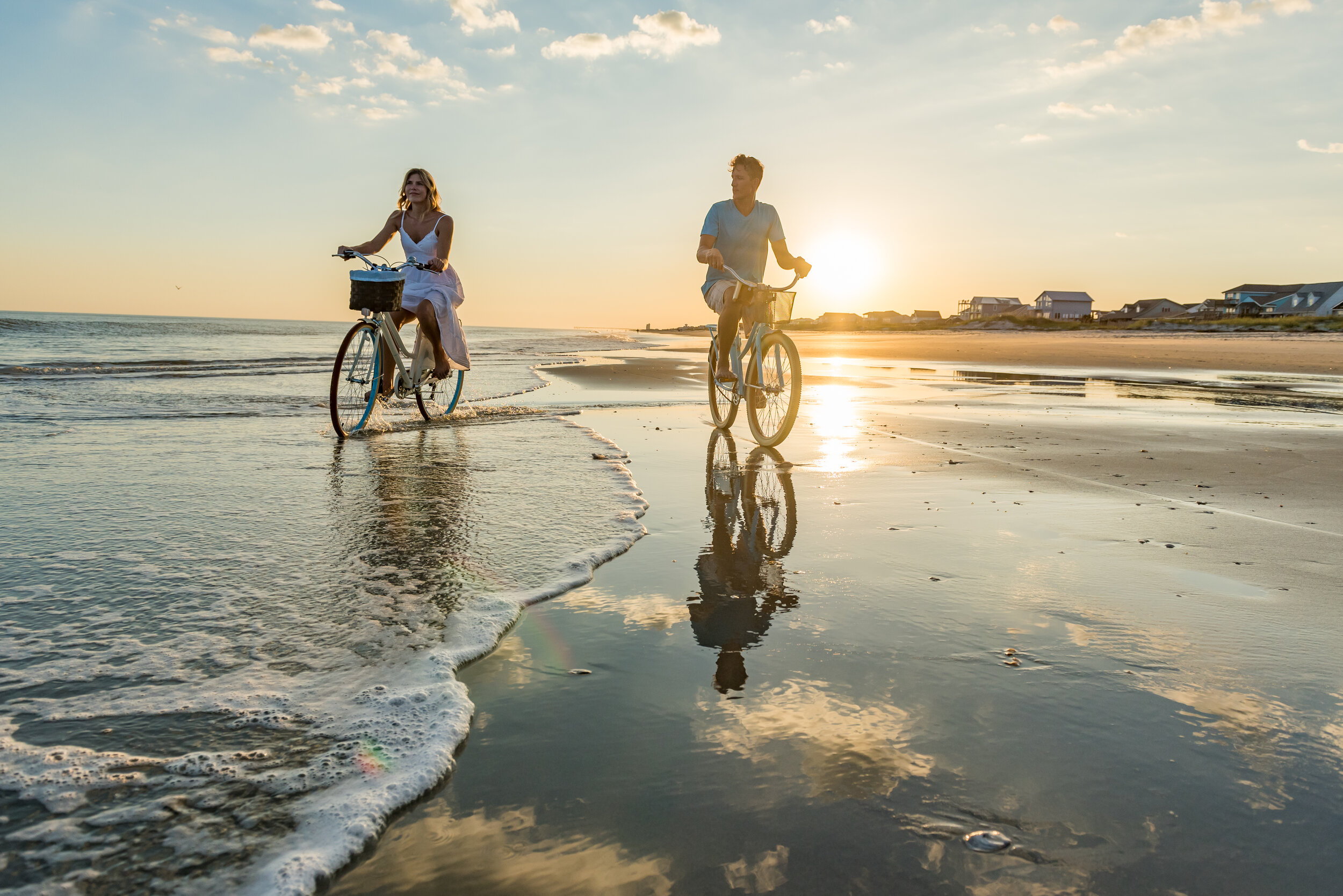 NCPN Ocean Isle Beach Couple Riding Bikes (1).jpg