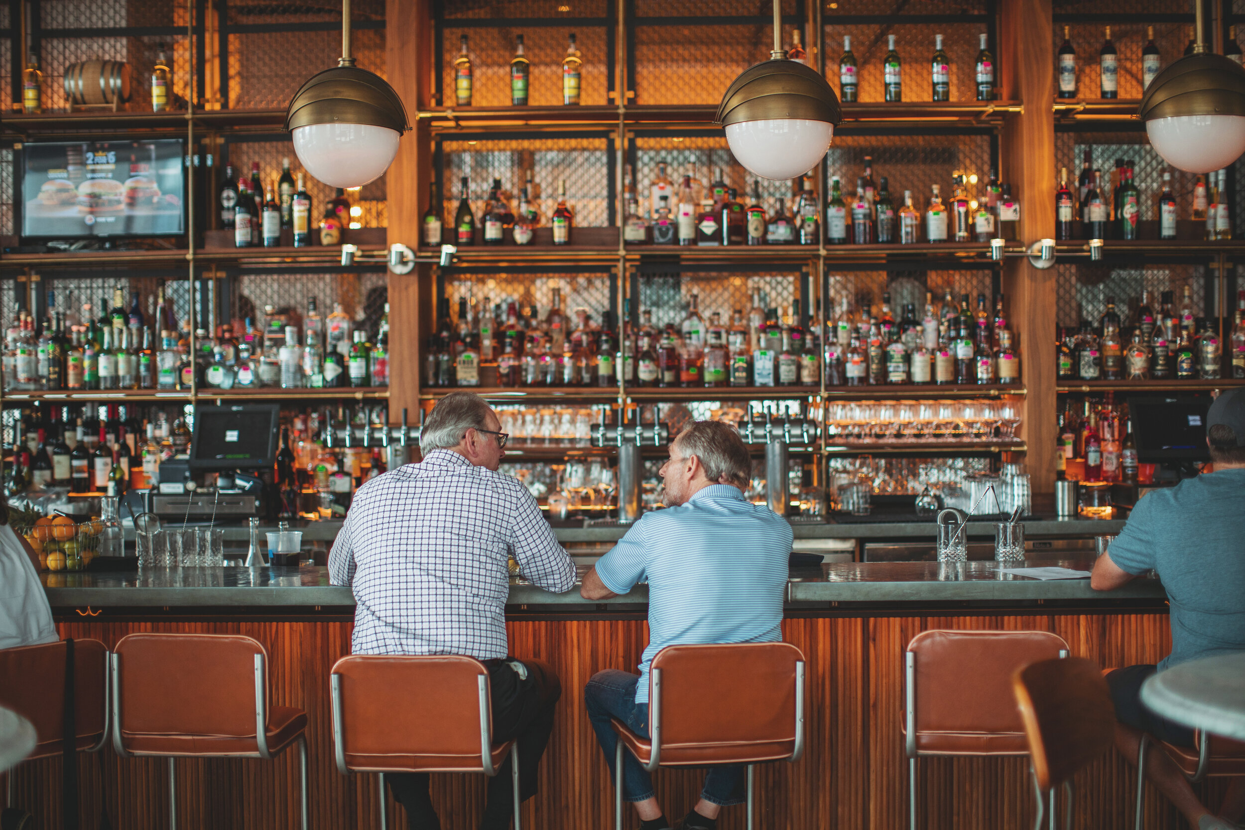 Kimpton Cardinal Hotel Downtown Winston-Salem Men Sitting at The Katherine Bar copy.jpg