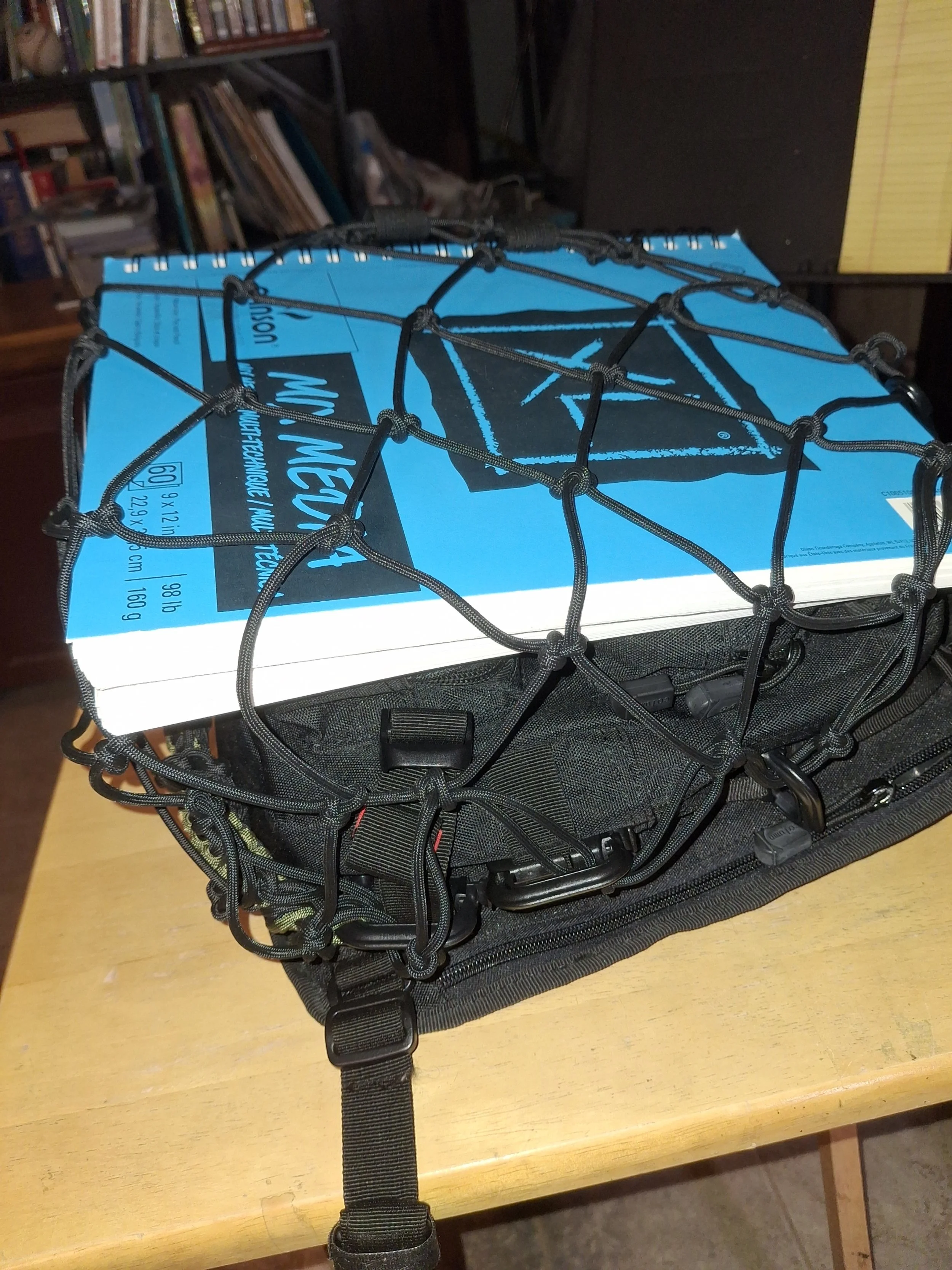 Create anchor points for your backpack net… ingenuity at its best to make it work.