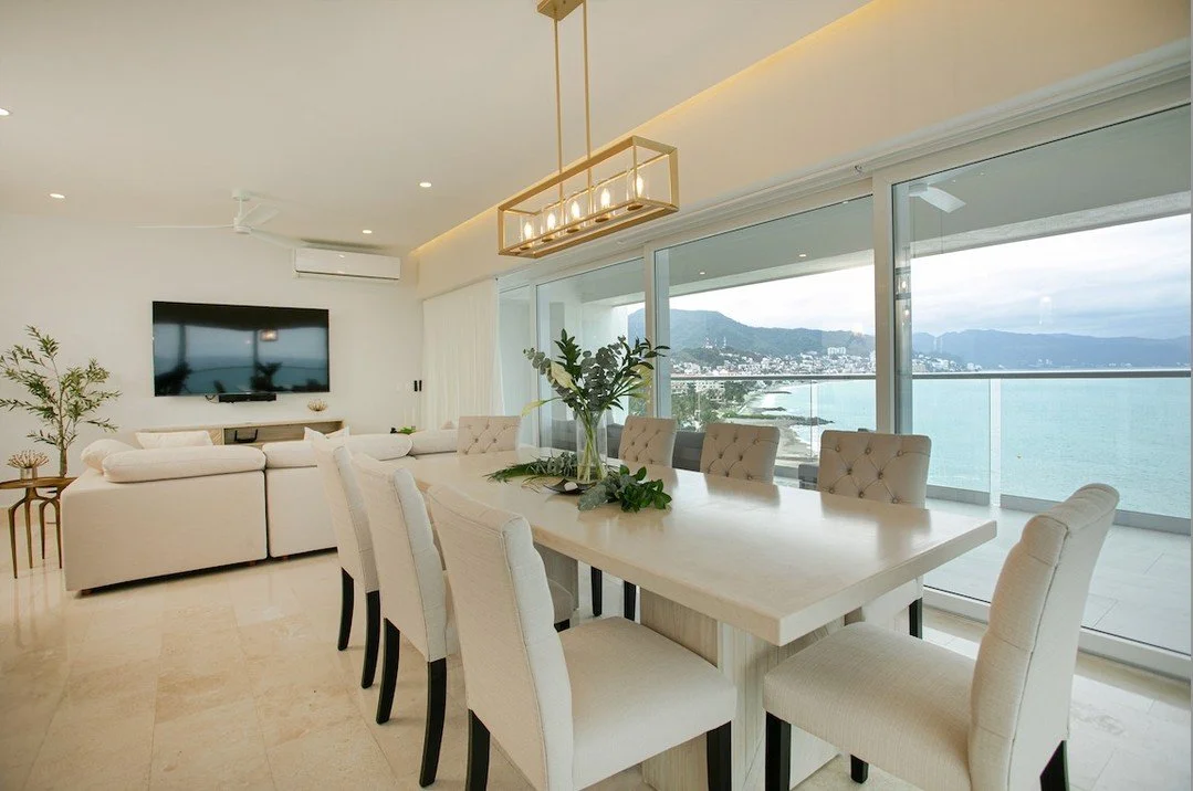 VIEWS ON VIEWS: CRATE Interiors totally understood that the view is the main event here! 
🌊 They custom created  this amazing limestone top dining table and layout that allows guest to enjoy the Bay of Banderas from every angle. The neutral color p