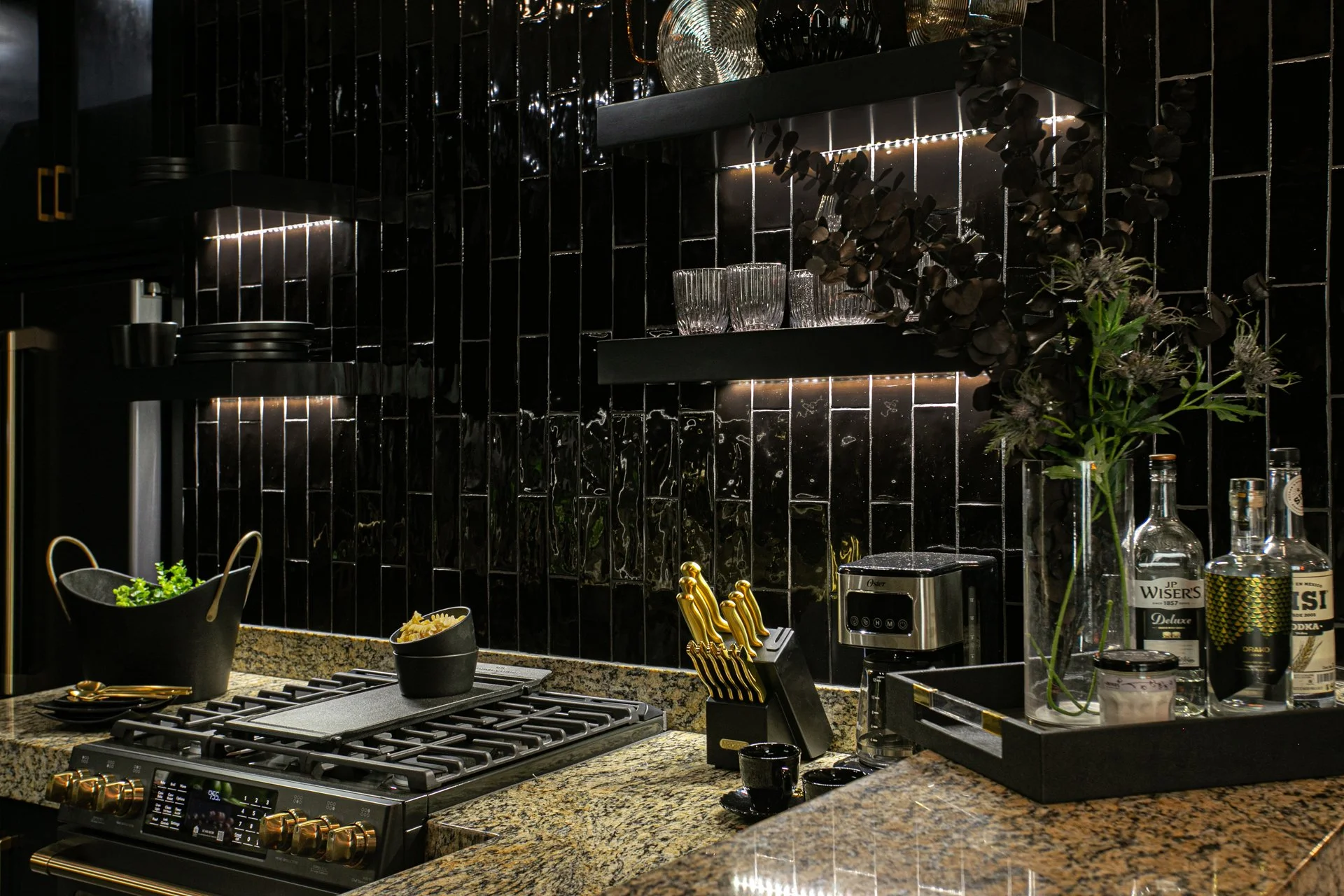 Our iconic all-black kitchen renovation. A full gut project featuring GE Cafe appliances, subway tile, custom cabinetry and all black accessories and dishwater.