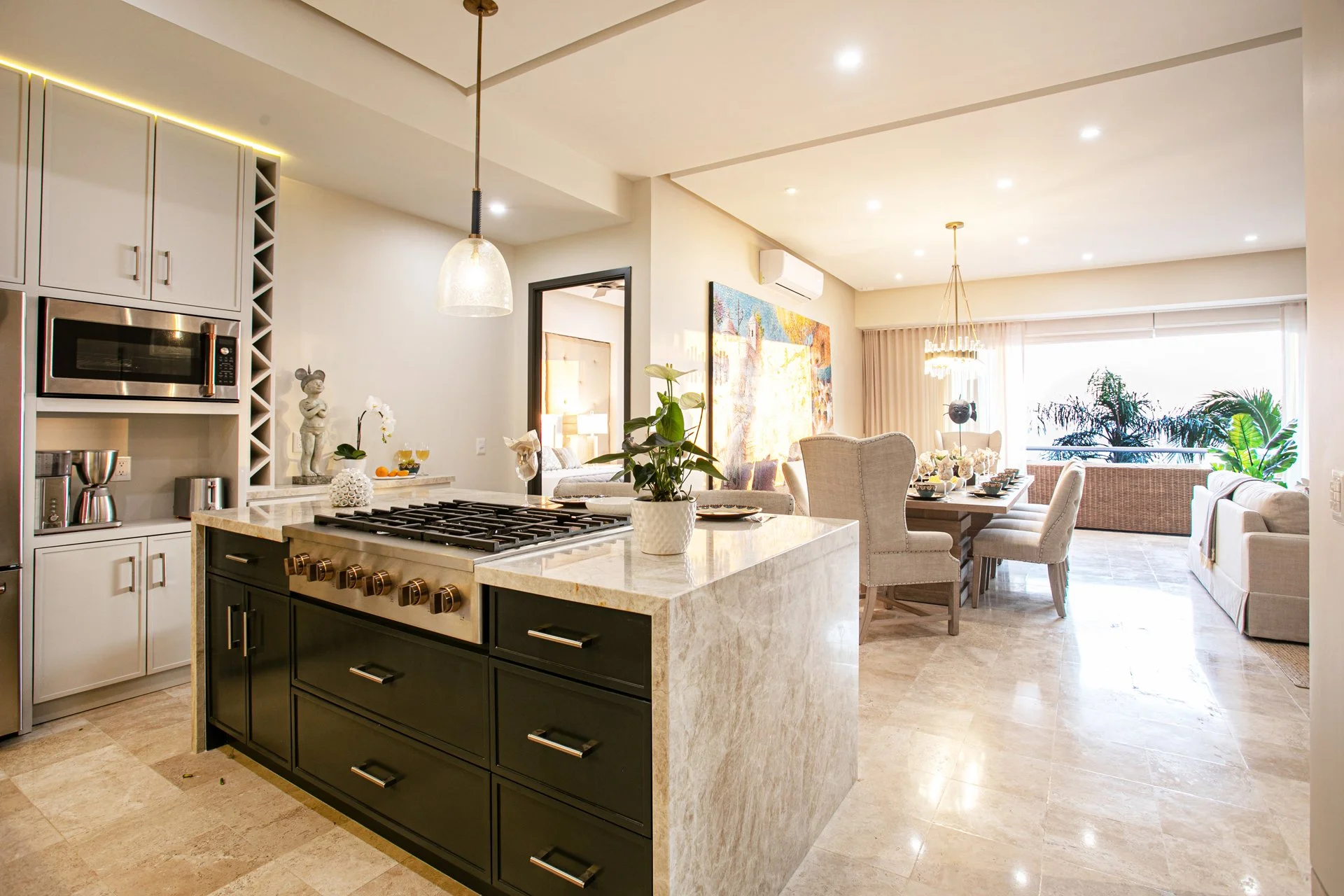 A full gut kitchen renovation featuring expanded island, Taj Mahal quartzite and GE Cafe appliances
