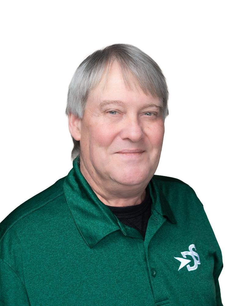 photo of an adult male with white/greyish hair wearing a green shirt with the D&S logo on it