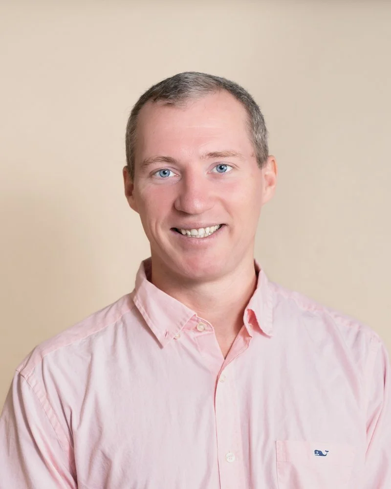 young male in a pink shirt