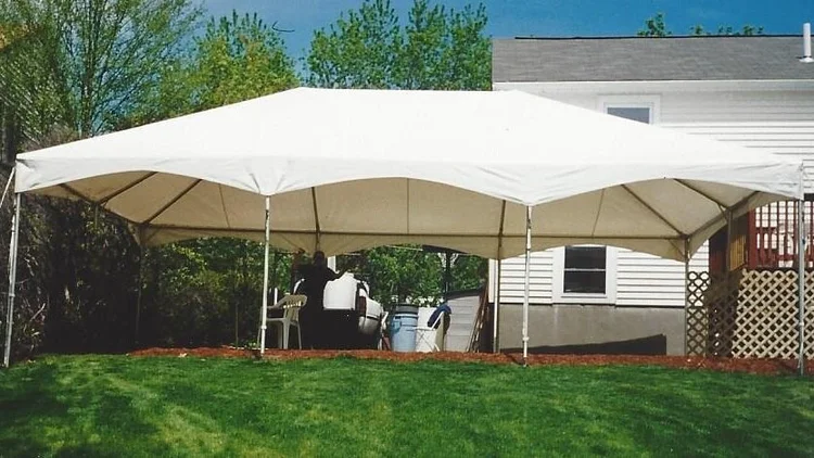 20x30 white frame tent set up in a backyard