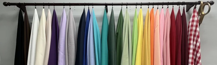 Rack of tablecloths in many colors