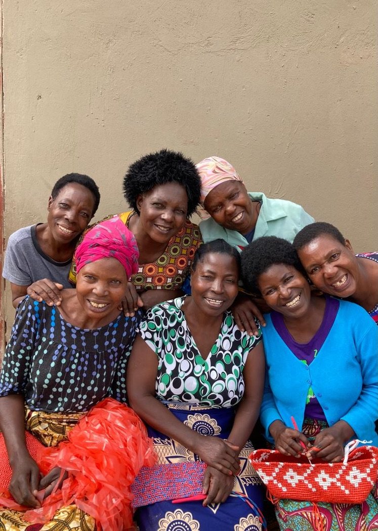 the ladies who make the bags from crochet platsic strips