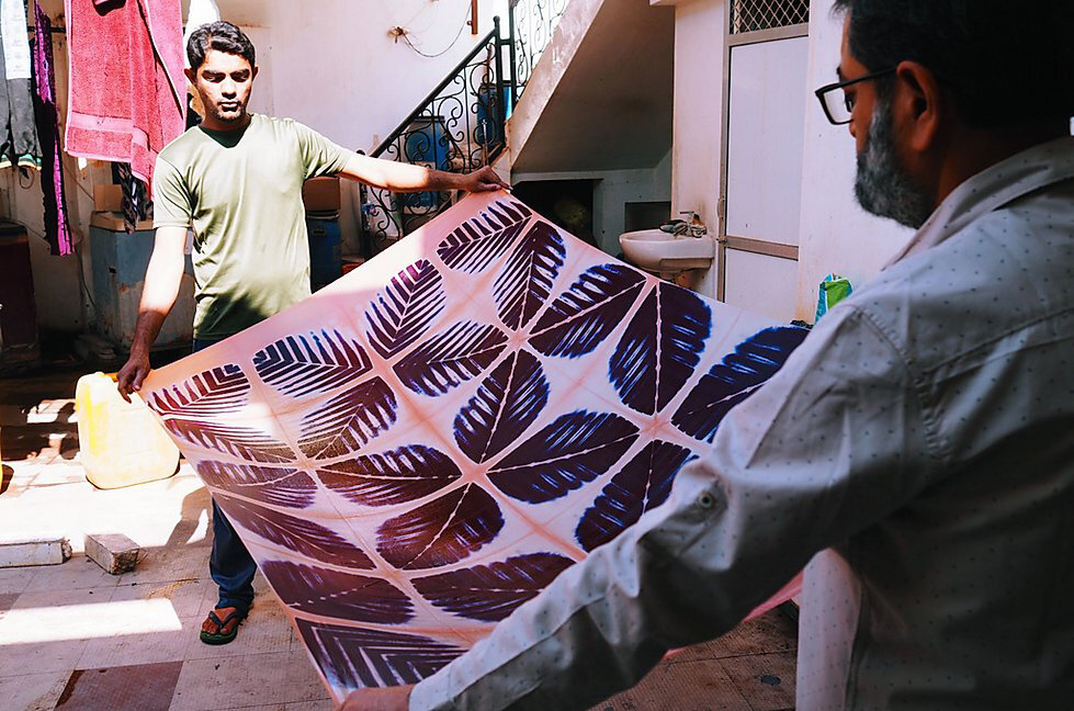 Artisans making Itajime Habutai Silk Resist-Dyed Scarves