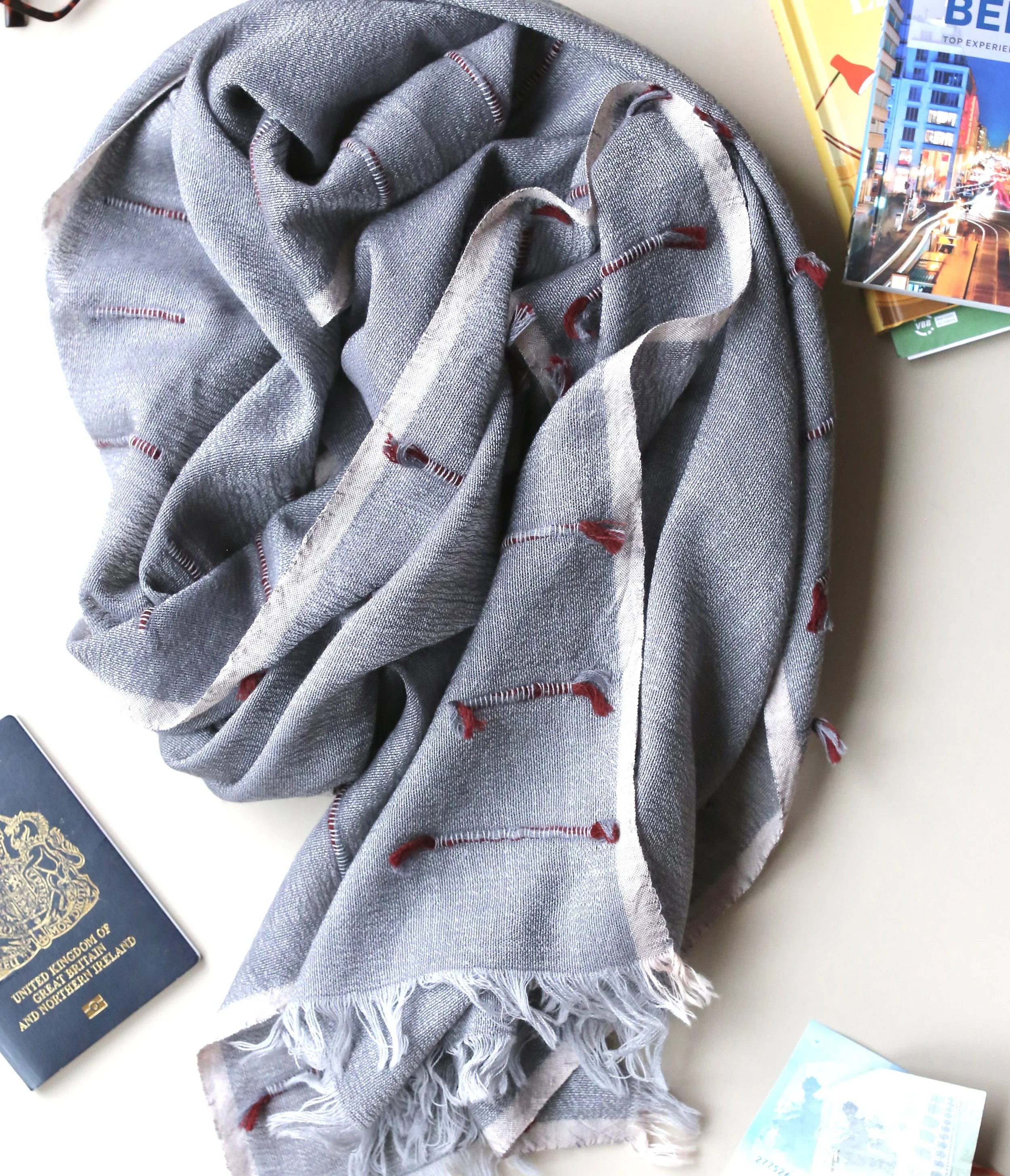 fine grey wool scarf with coloured detail and raw edge