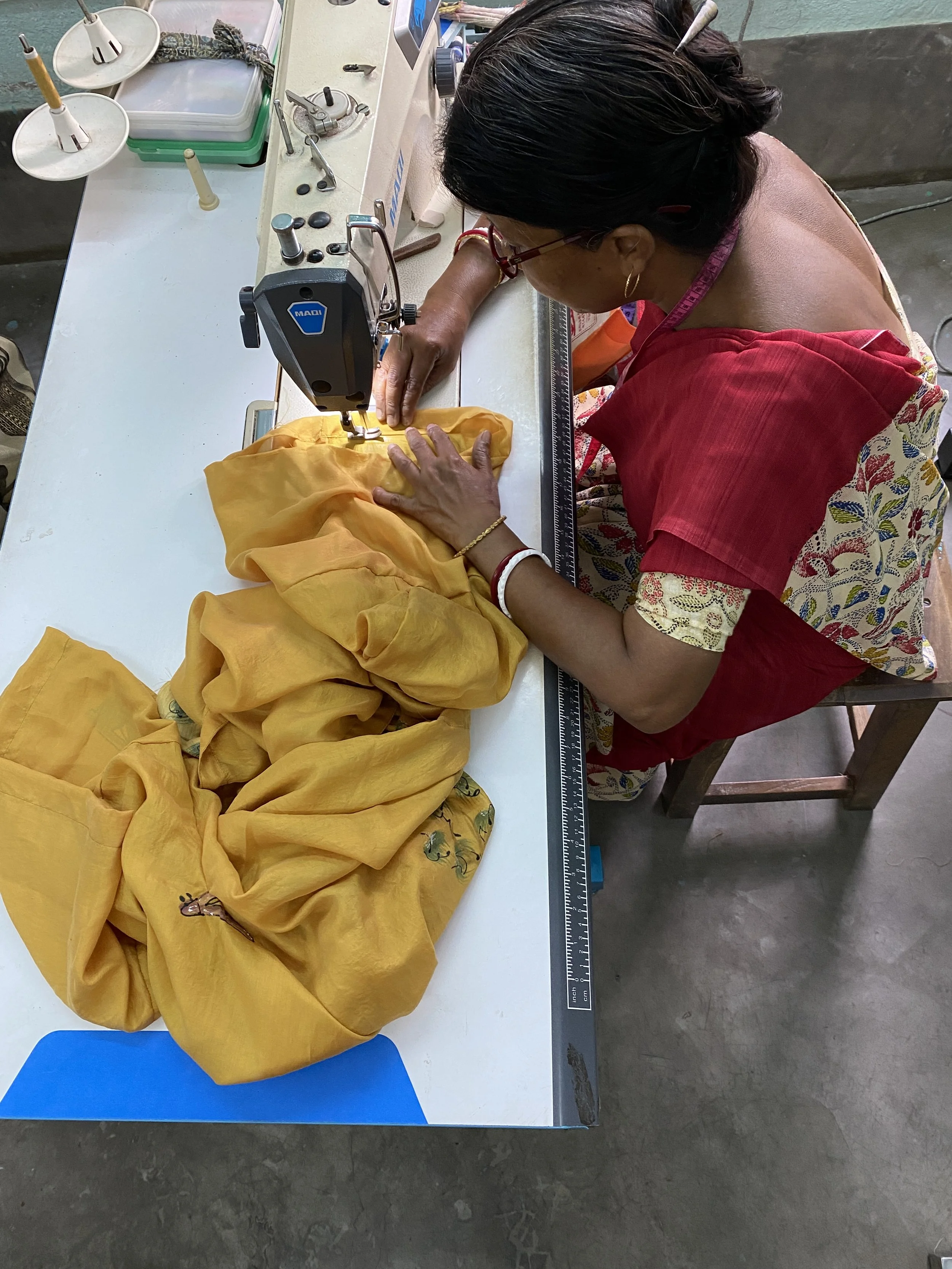 ladies sewing our sari kimonos in west Bengal