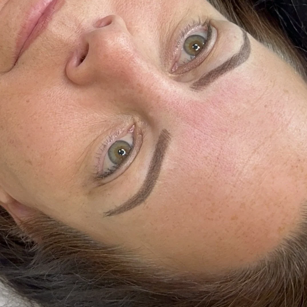 Close-up of a woman's face with microbladed eyebrows.
