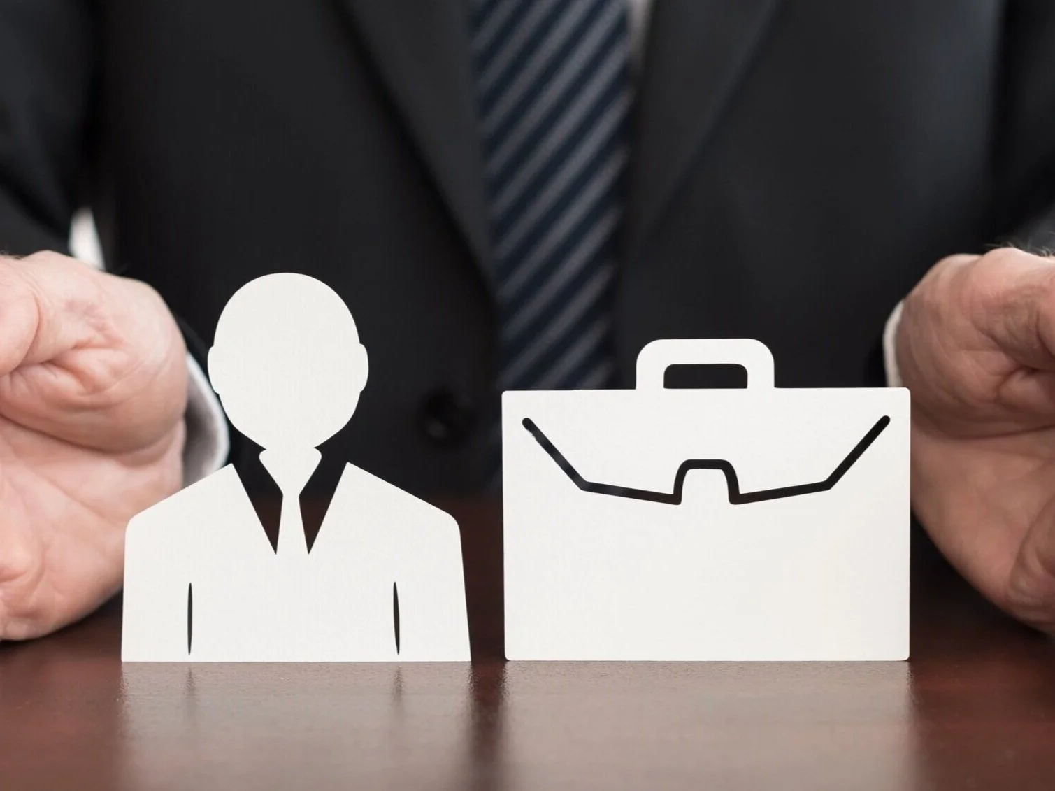 insurance agent with business owner and briefcase in his hands