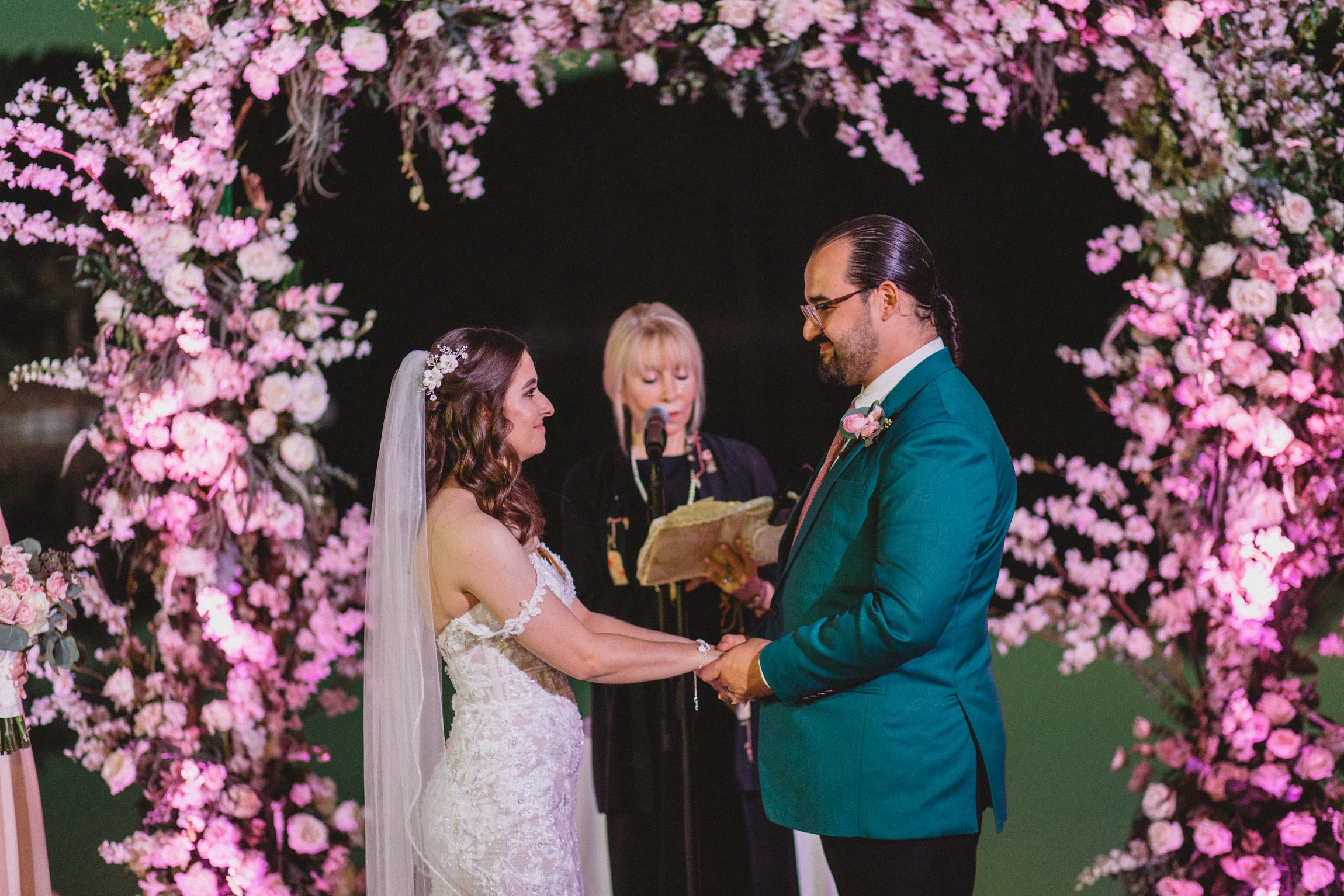 Japanese garden wedding before pink floral arch