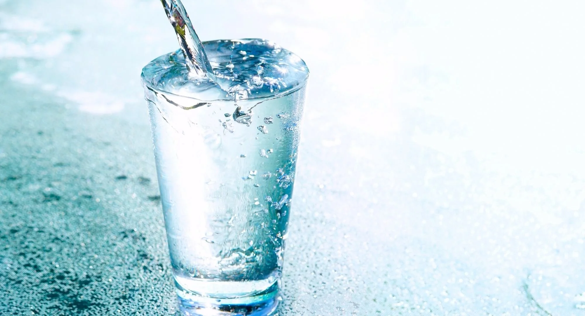 Glass of water being poured