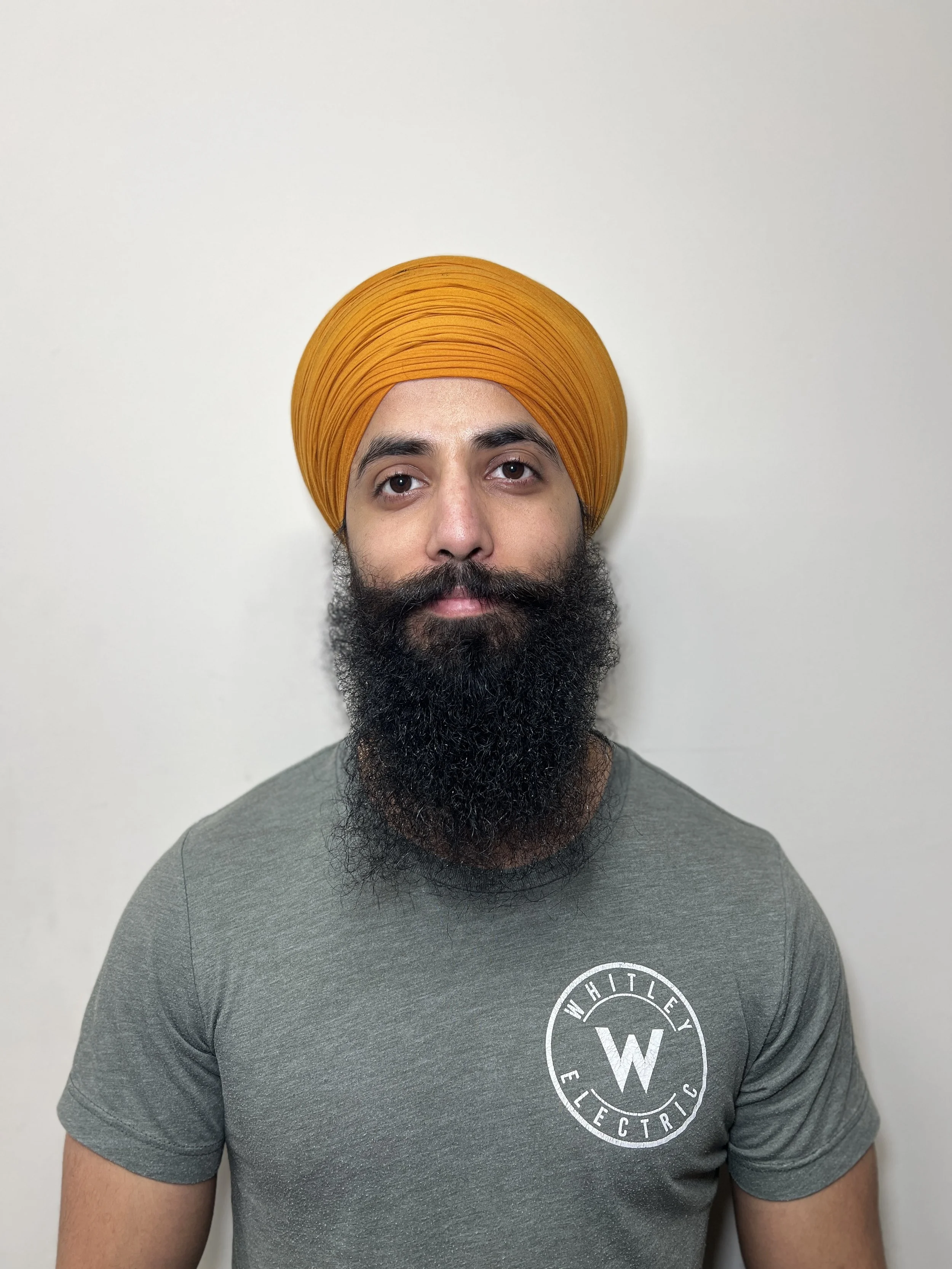 An electrician posing for a photo for Whitley electric in Vancouver