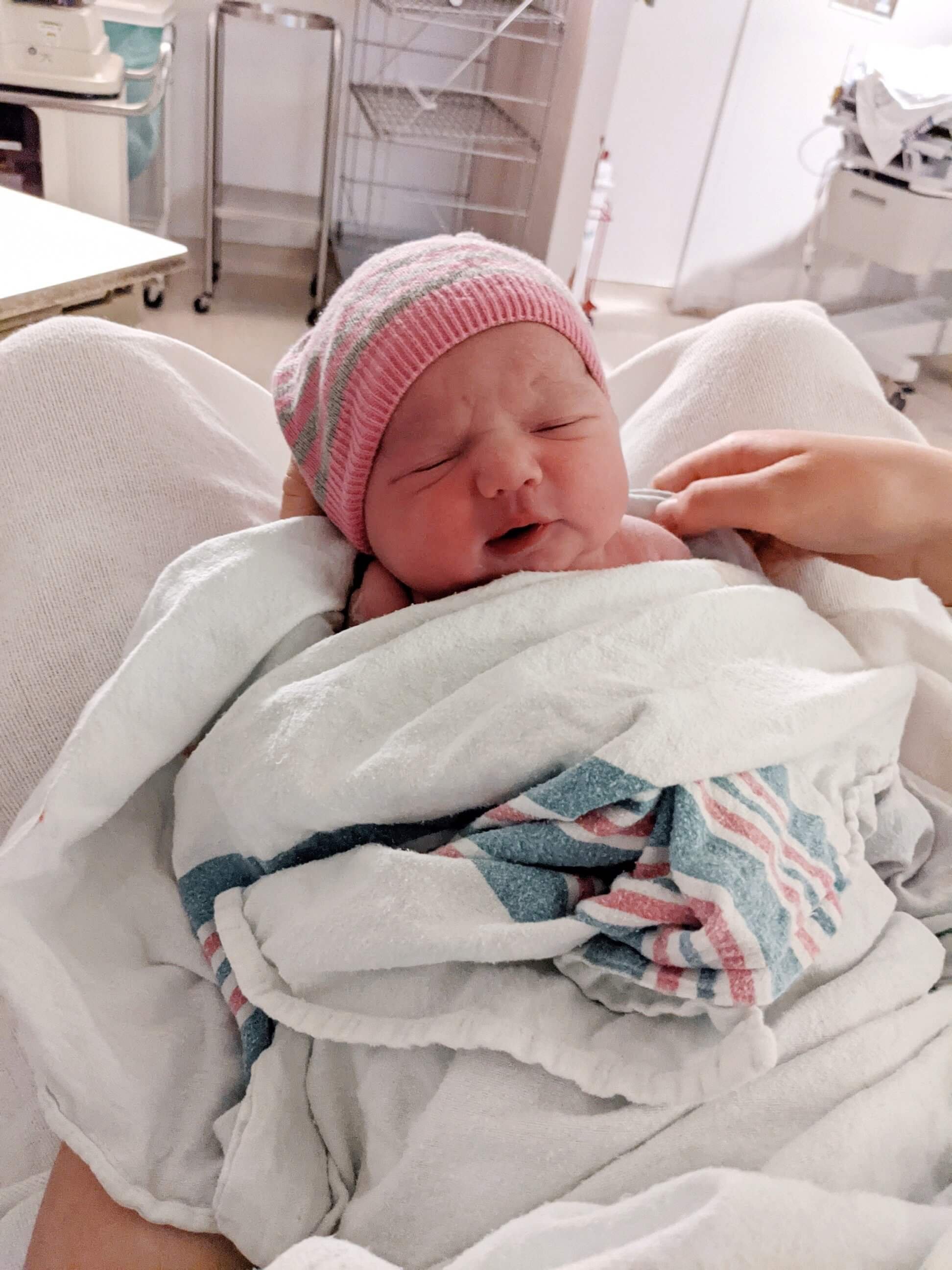 Selah Bloom wrapped in a blanket with her sweet chubby cheeks in the hospital!